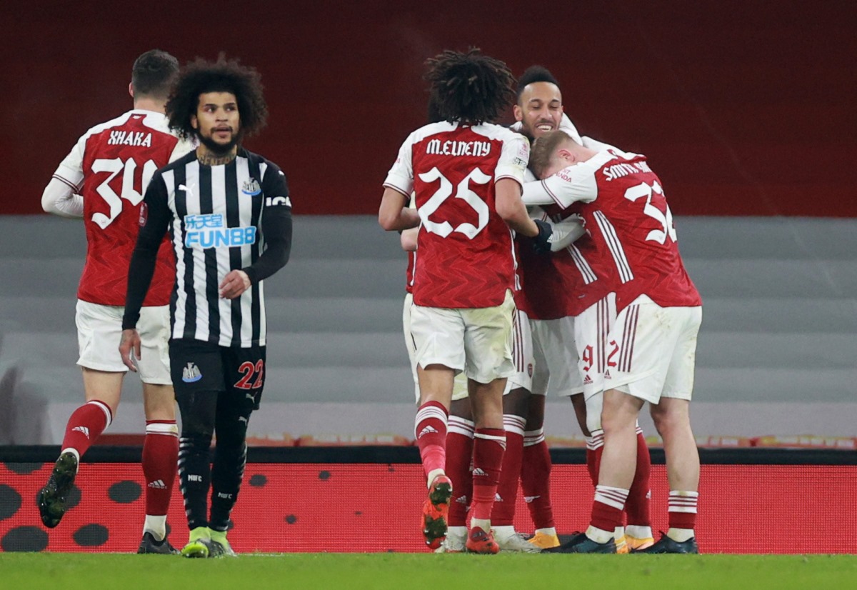 Soccer Football - FA Cup - Third Round - Arsenal v Newcastle United - Emirates Stadium, London, Britain - January 9, 2021 Arsenal's Pierre-Emerick Aubameyang celebrates scoring their second goal with teammates REUTERS