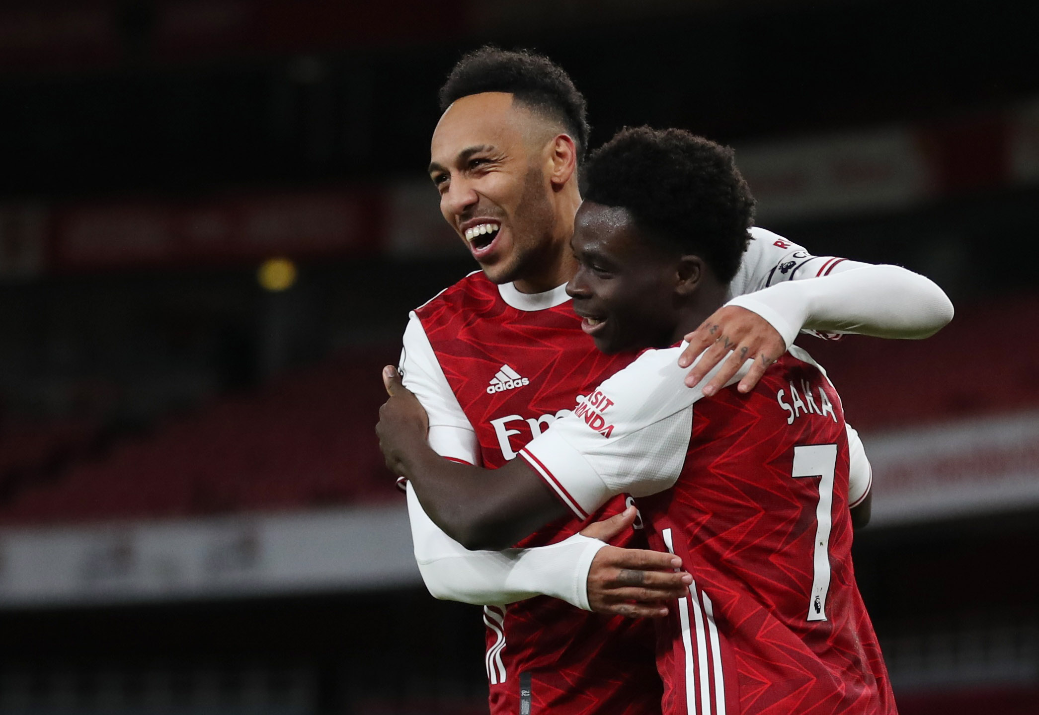 Soccer Football - Premier League - Arsenal v Newcastle United - Emirates Stadium, London, Britain - January 18, 2021 Arsenal's Bukayo Saka celebrates scoring their second goal with Pierre-Emerick Aubameyang Pool via REUTERS