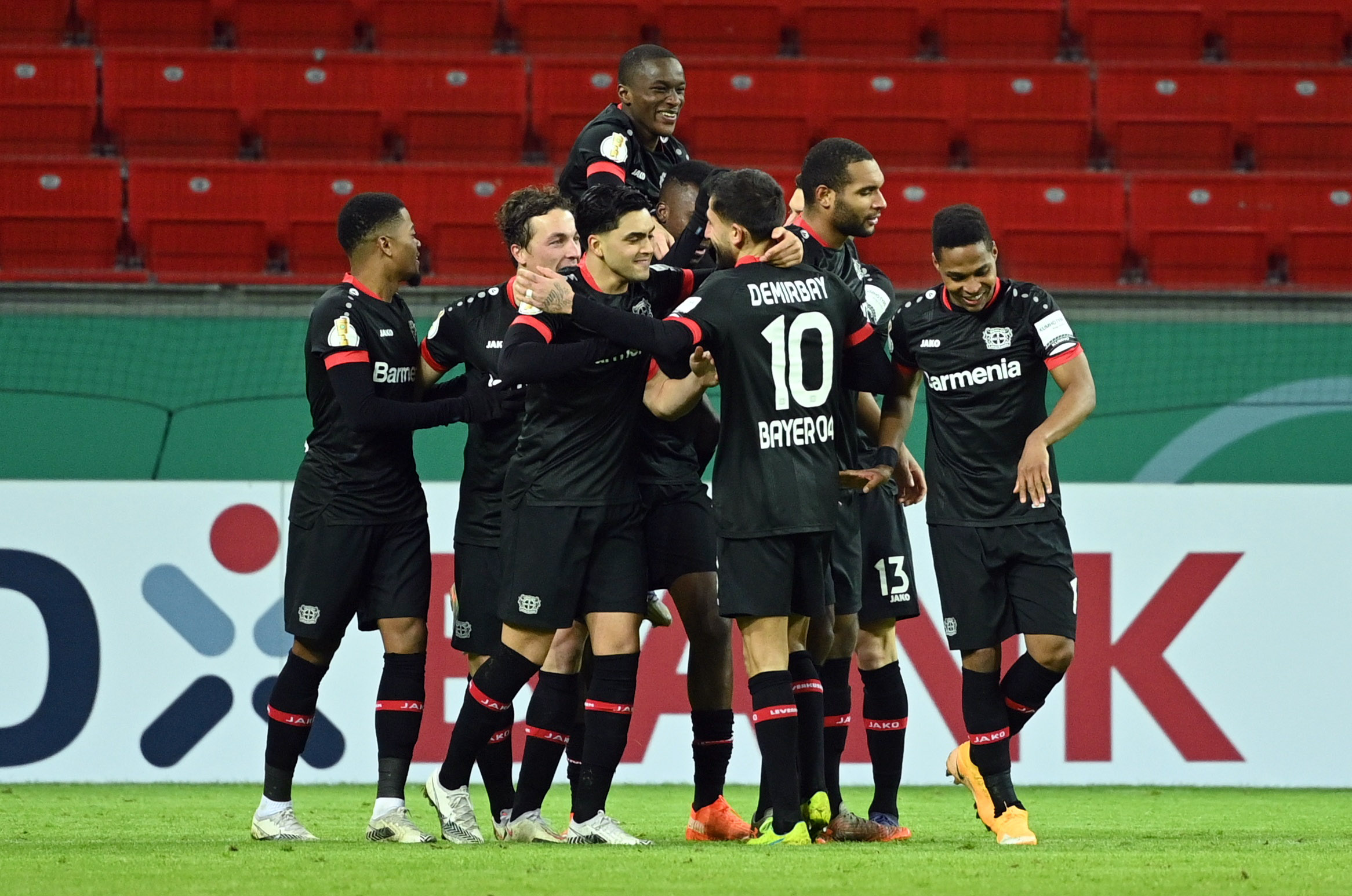 Soccer Football - DFB Cup - Second Round - Bayer Leverkusen v Eintracht Frankfurt - BayArena, Leverkusen, Germany - January 12, 2021 Bayer Leverkusen's Edmond Tapsoba celebrates scoring their second goal with teammates Pool via REUTERS