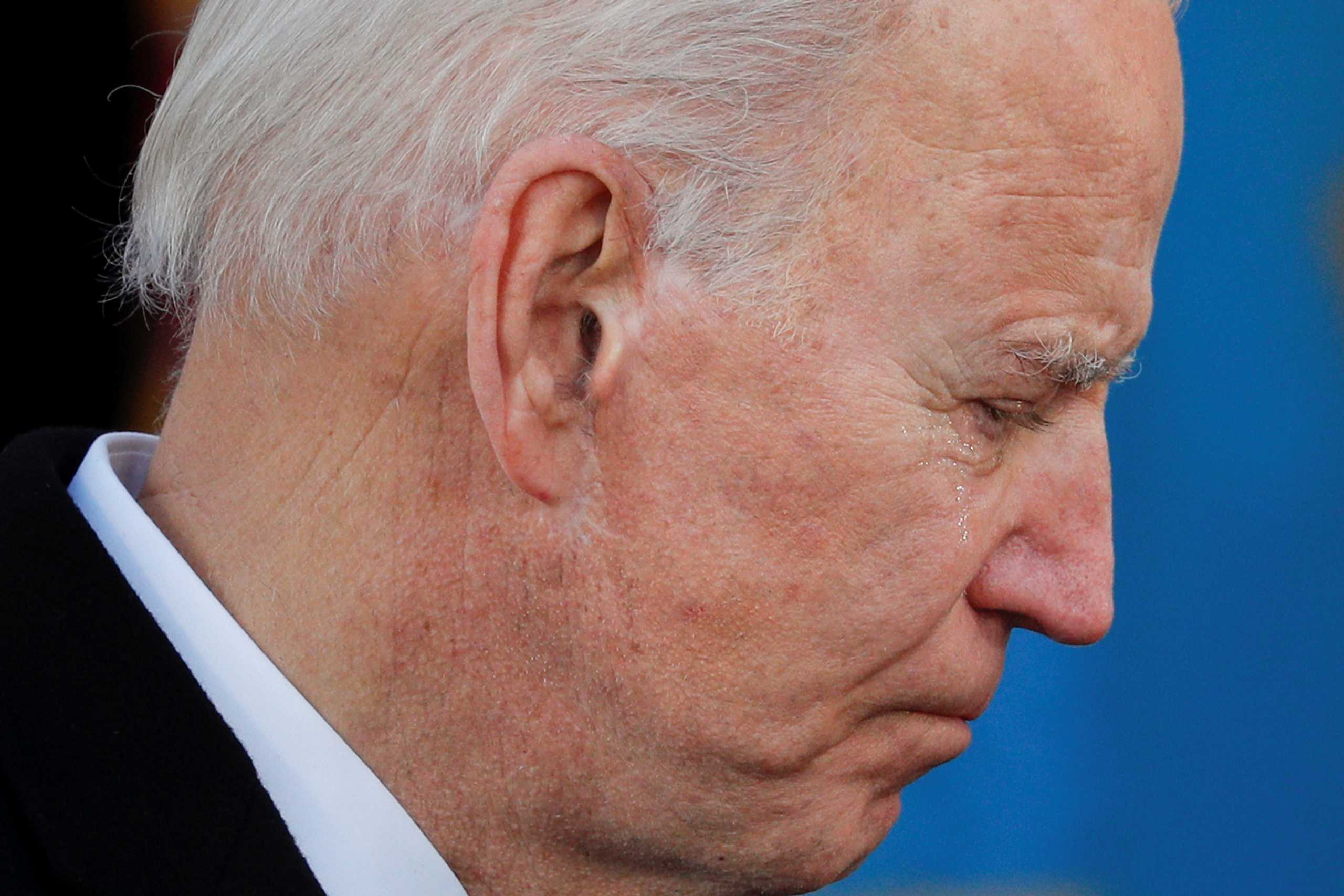 U.S. President-elect Joe Biden cries during an event at Major Joseph R. "Beau" Biden III National Guard
