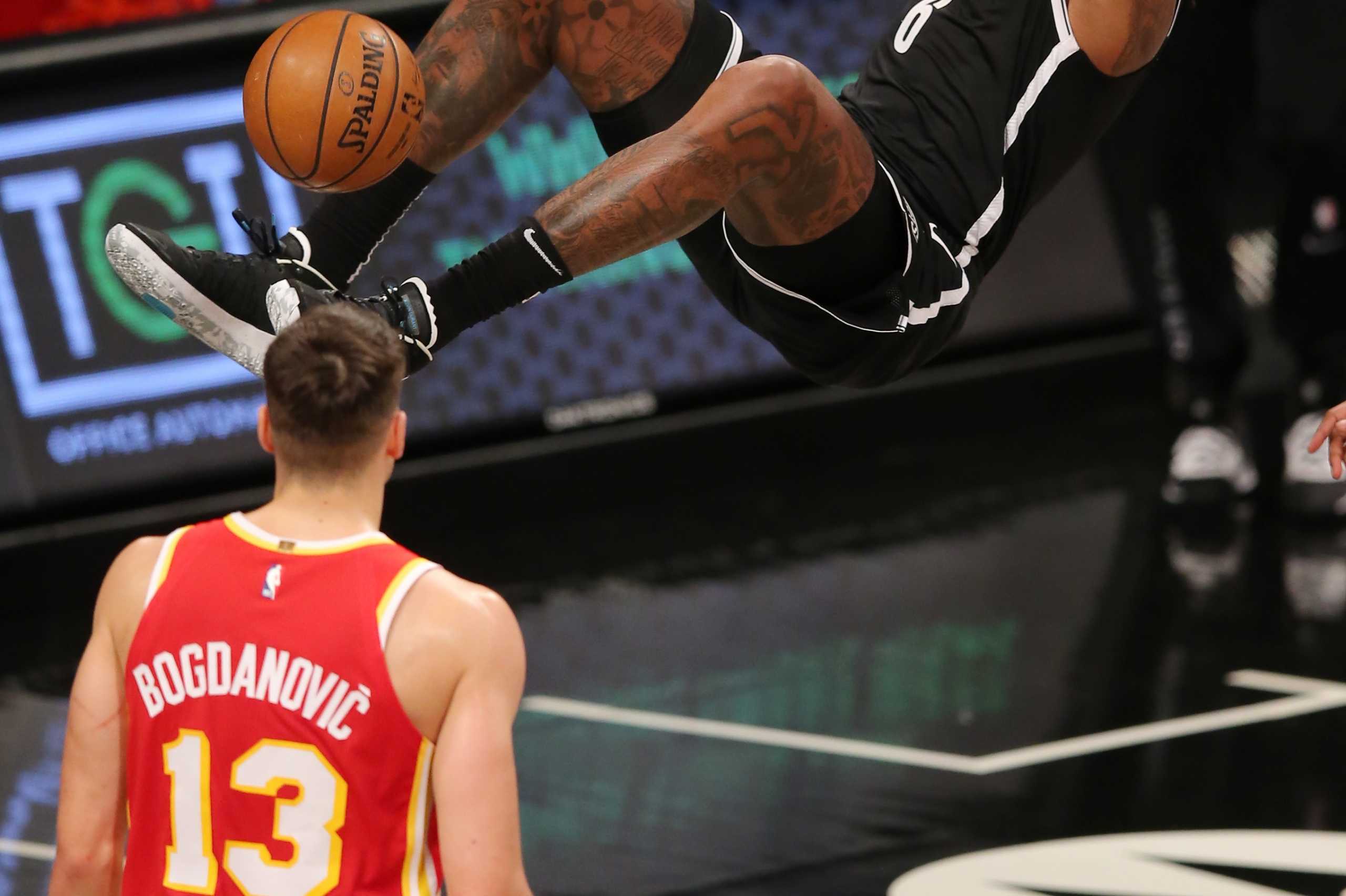Jan 1, 2021; Brooklyn, New York, USA; Brooklyn Nets center DeAndre Jordan (6) dunks again Atlanta Hawks shooting guard Bogdan Bogdanovic (13) during the second quarter at Barclays Center. Mandatory Credit: Brad Penner-USA TODAY Sports
