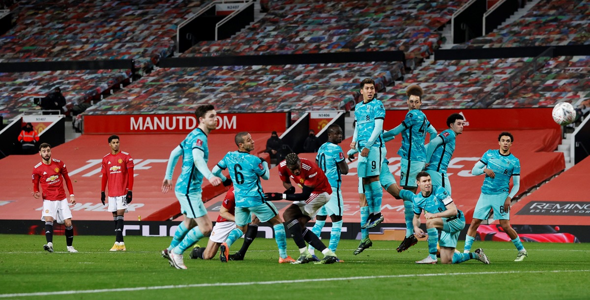 Soccer Football - FA Cup - Fourth Round - Manchester United v Liverpool - Old Trafford, Manchester, Britain - January 24, 2021 Manchester United's Bruno Fernandes scores their third goal from a free kick Pool via REUTERS