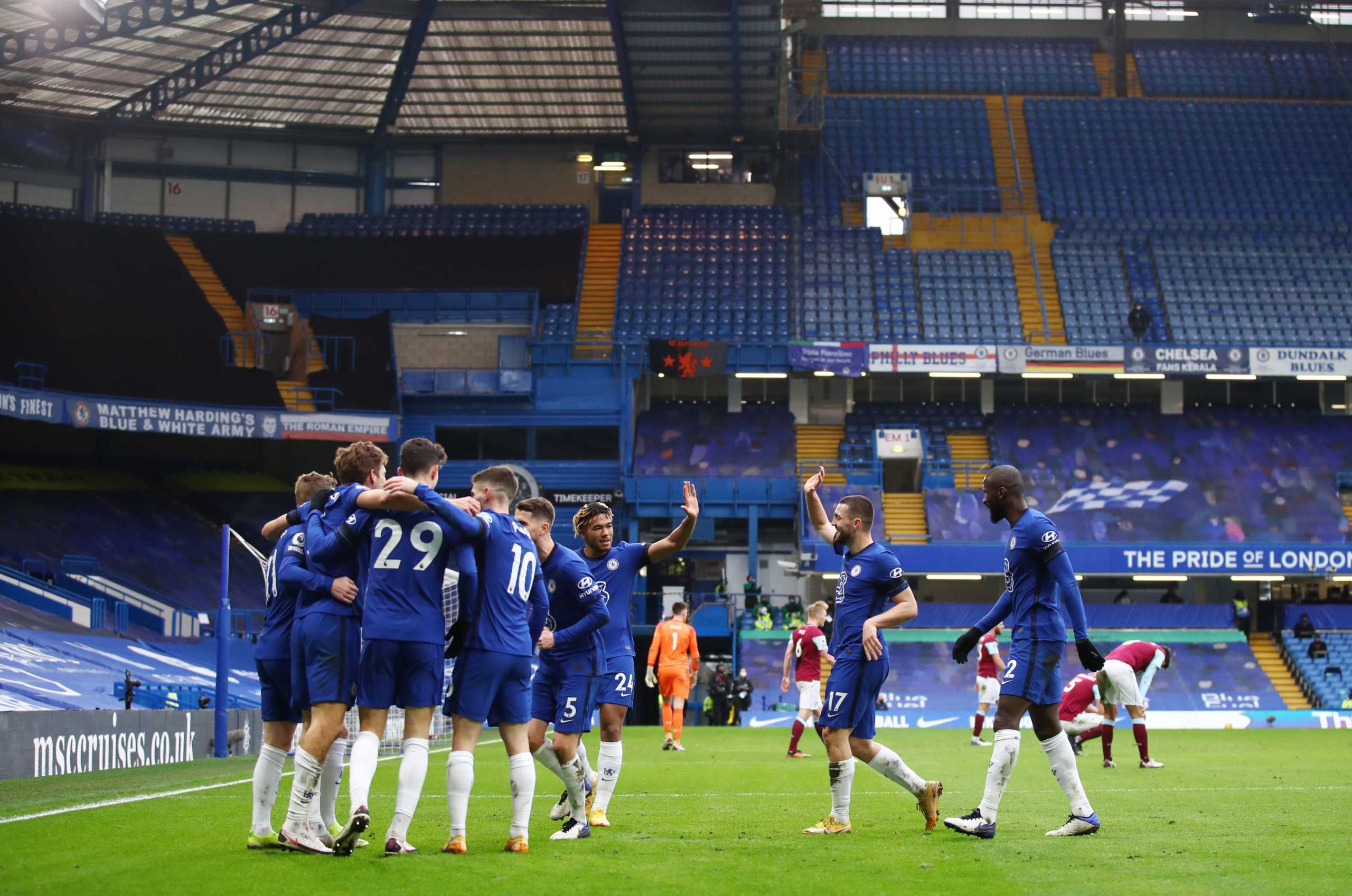 Soccer Football - Premier League - Chelsea v Burnley - Stamford Bridge, London, Britain - January 31, 2021 Chelsea's Marcos Alonso celebrates scoring their second goal with teammates Pool via REUTERS