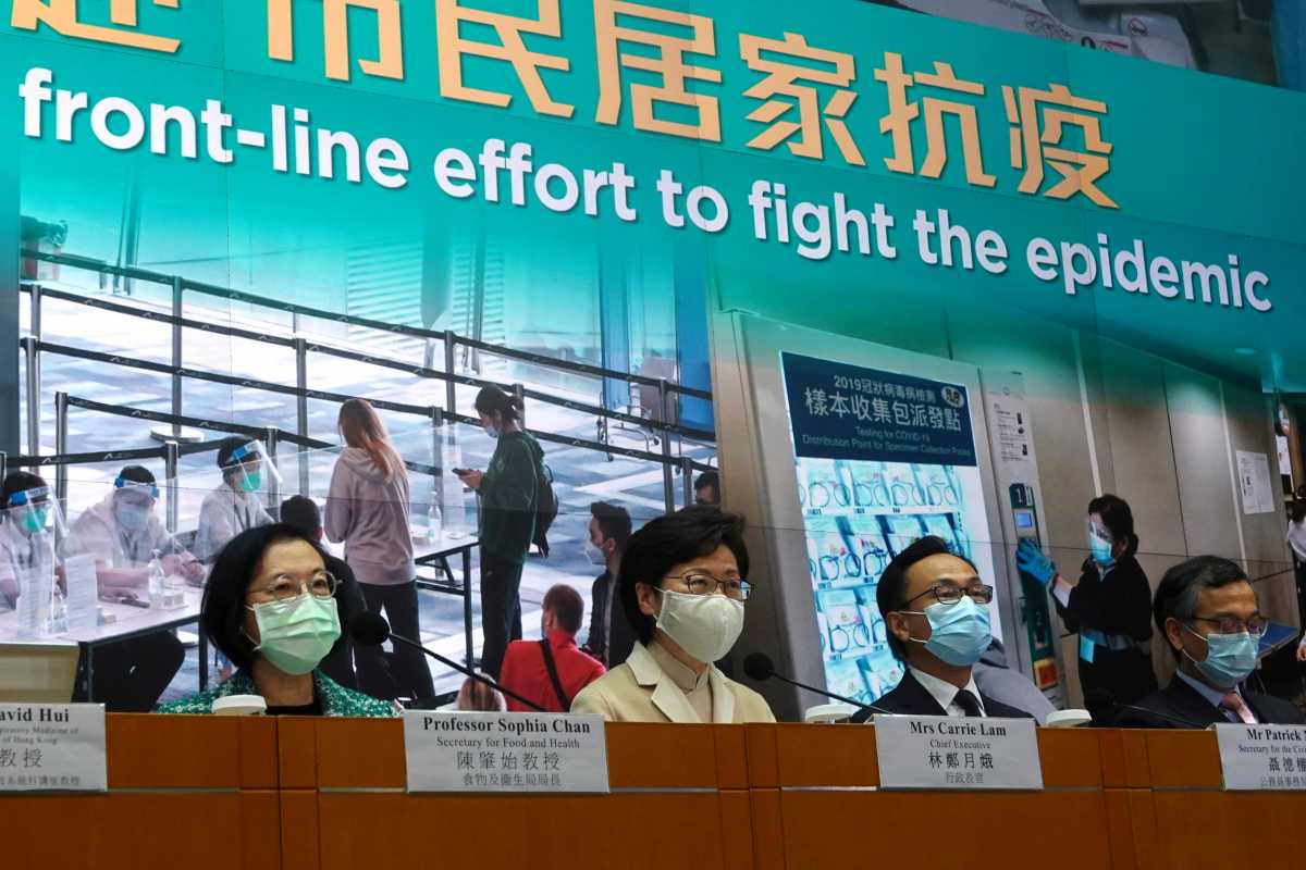 Hong Kong Chief Executive Carrie Lam wearing a mask attends a news conference on government's strategy for COVID-19 vaccinations, in Hong Kong, China December 23, 2020. REUTERS
