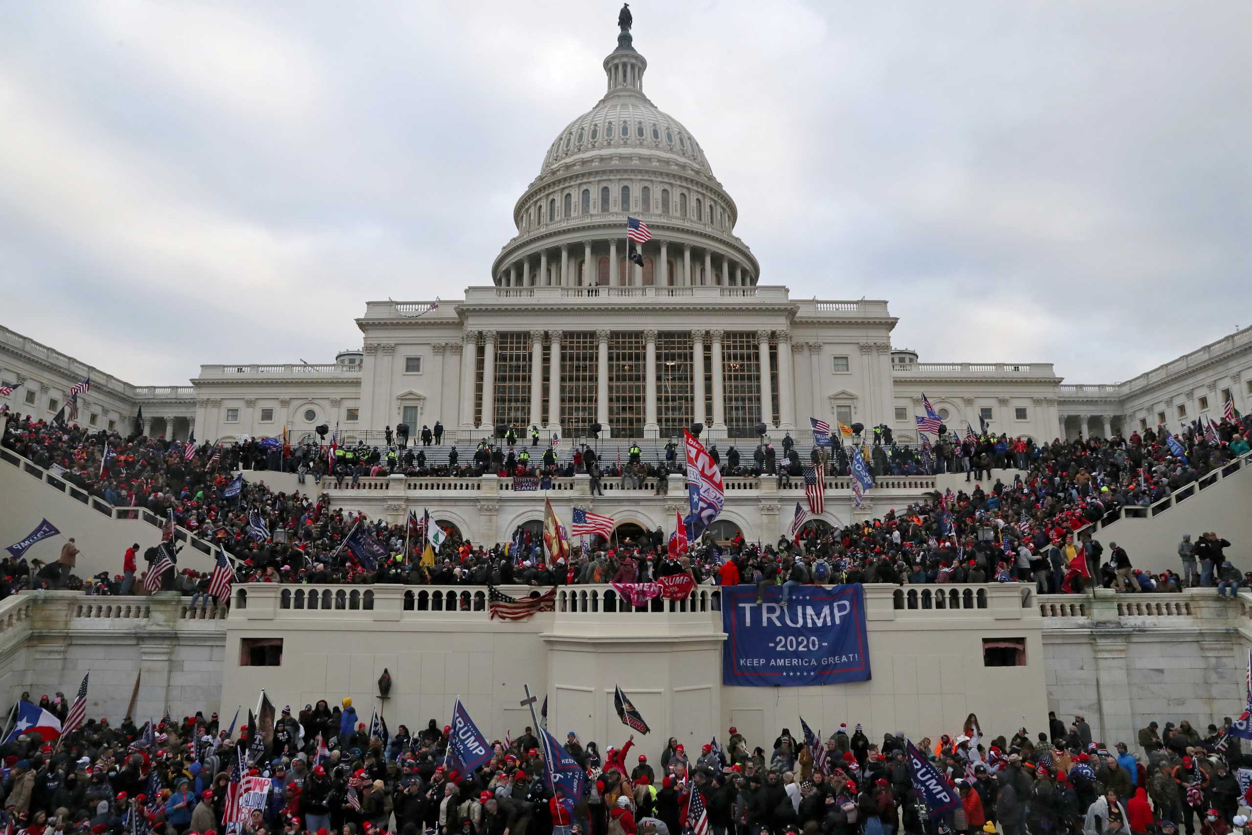 A mob of supporters of U.S. President Donald Trump storm the U.S. Capitol Building in Washington, U.S., January 6, 2021. Picture taken January 6, 2021. REUTERS