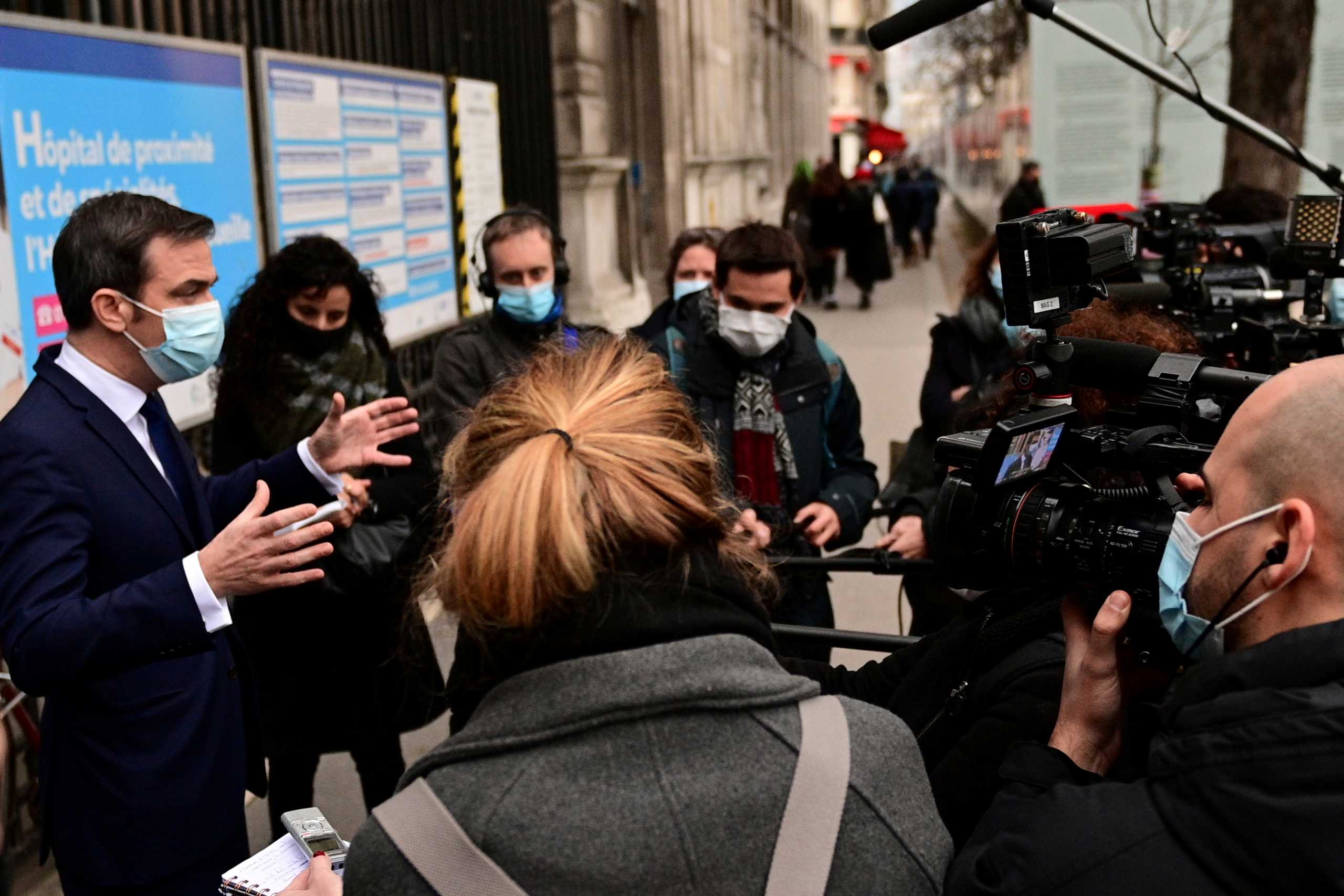 French Health Minister Olivier Veran speaks to the media as he arrives to attend the vaccination of health workers, at the vaccination centre of Hotel Dieu (Assistance Publique - Hopitaux de Paris) in Paris, France January 4, 2021, as part of the launch of the vaccination campaign for healthcare professionals over 50 and