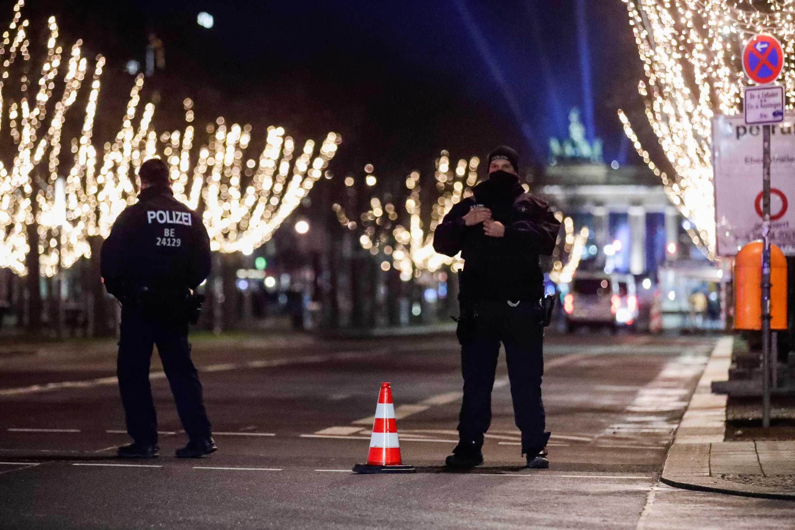 Police officers secure the area near the Brandenburg Gate on New Year's Eve, amid coronavirus disease (COVID-19) restrictions in Berlin, Germany December 31, 2020. REUTERS