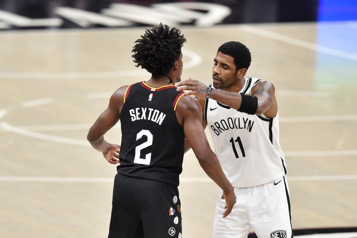 Jan 20, 2021; Cleveland, Ohio, USA; Cleveland Cavaliers guard Collin Sexton (2) and Brooklyn Nets guard Kyrie Irving (11) after the CavliersΥ double overtime win at Rocket Mortgage FieldHouse. Mandatory Credit: David Richard-USA TODAY Sports