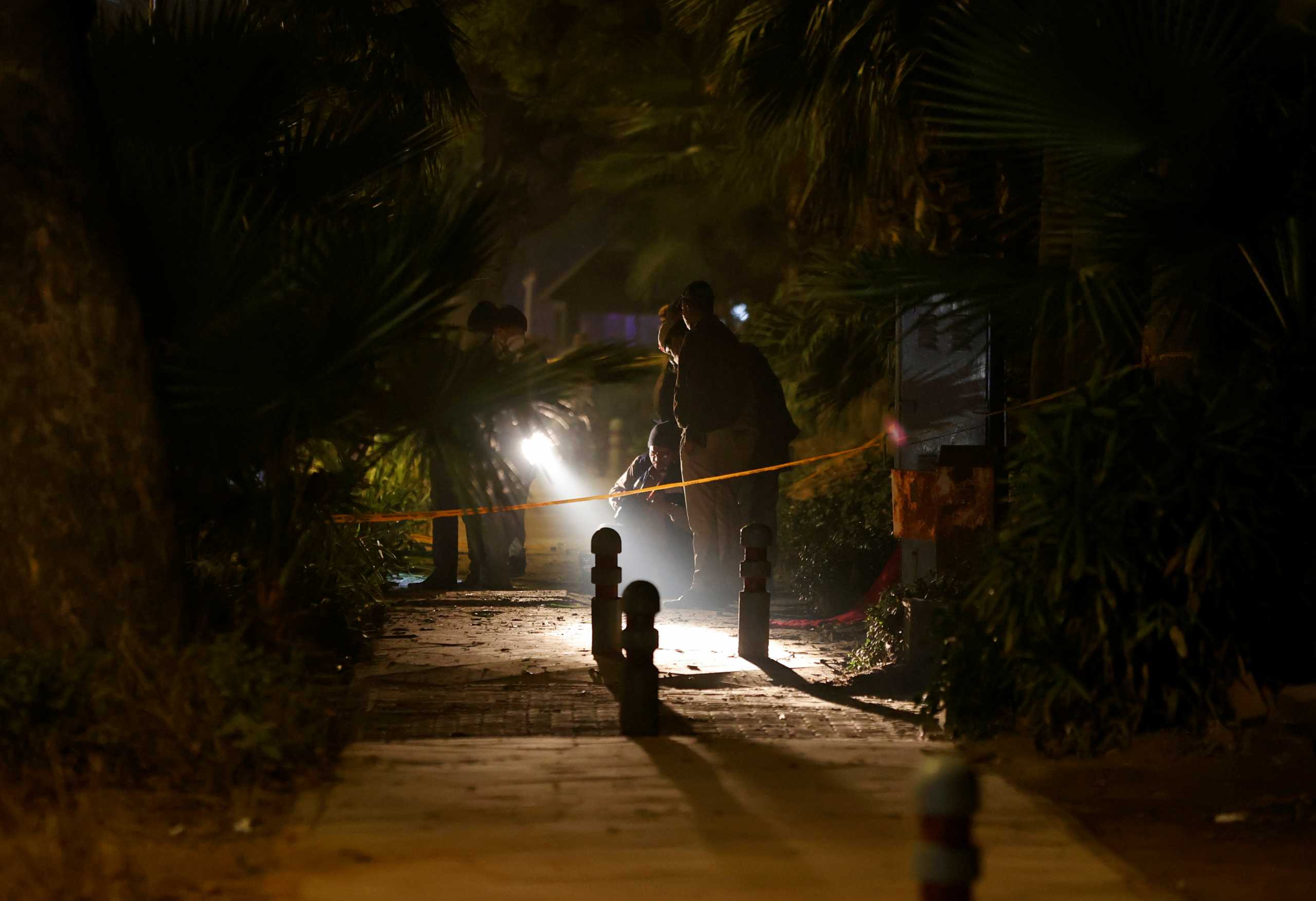 Security officials examine the site of an explosion near the Israeli embassy in New Delhi, India, January 29, 2021. REUTERS