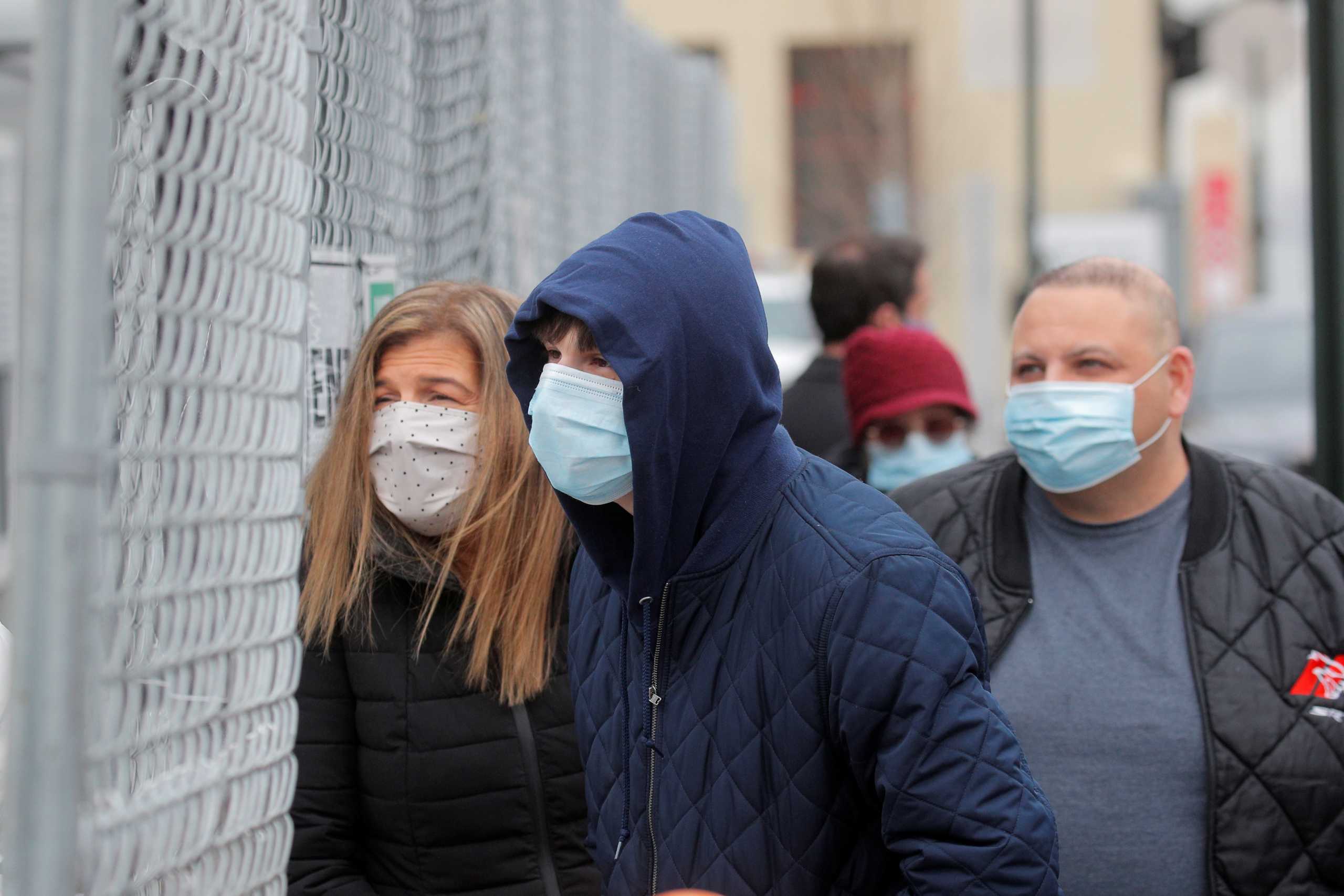 People line up to receive a dose of the coronavirus disease (COVID-19) vaccine at a 24 hour vaccination center at the Brooklyn Army Terminal in Brooklyn, New York, U.S., January 11, 2021.  REUTERS