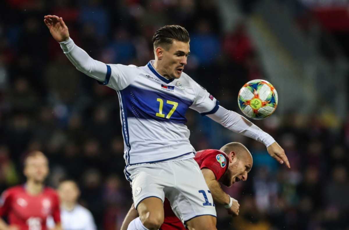 epa07996791 Michael Krmencik (R) of Czech Republic  in action against Benjamin Kololli of Kosovo during the UEFA EURO 2020 qualifier soccer match between Czech Republic and Kosovo in Plzen, Czech Republic, 14 November 2019.  EPA