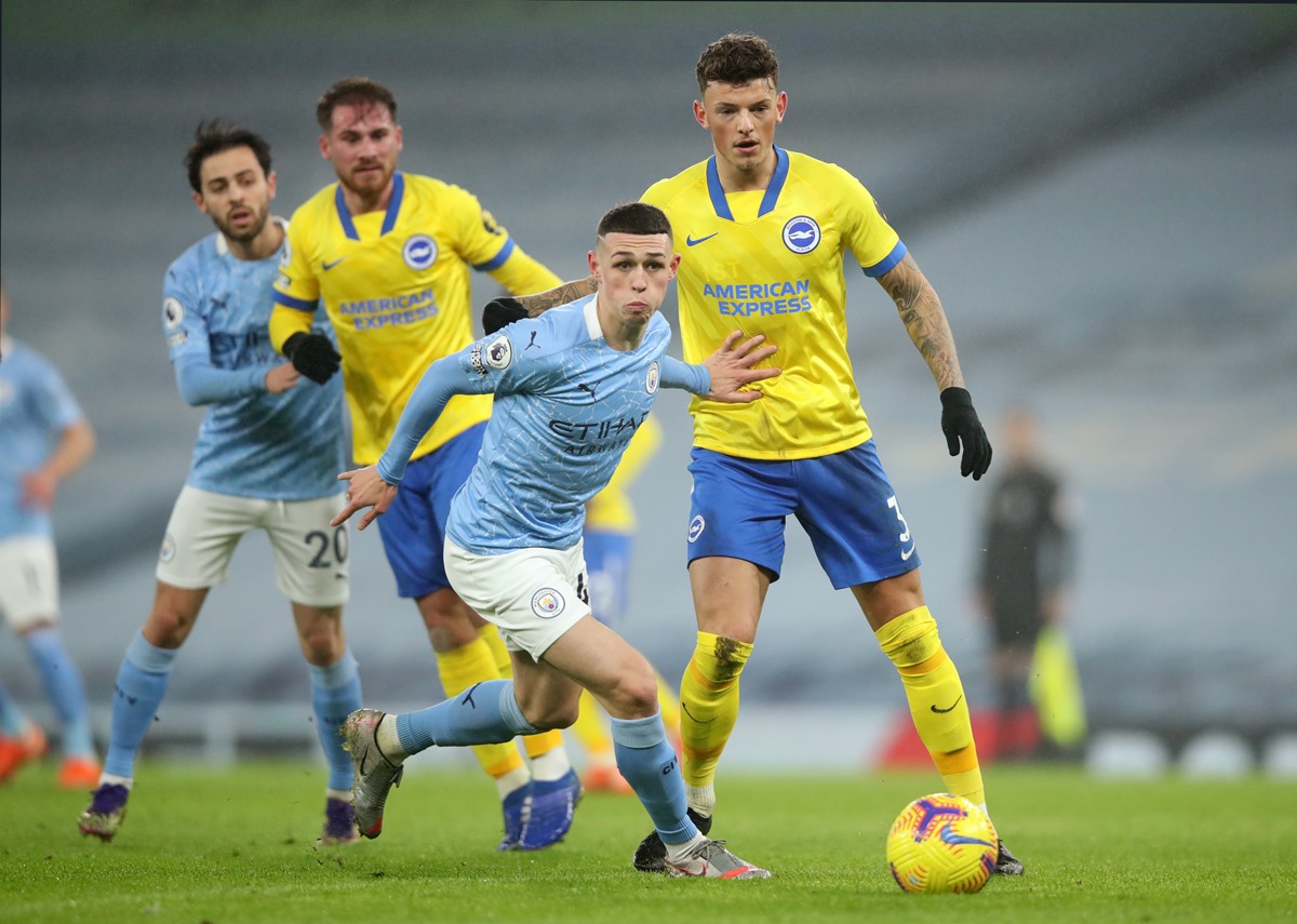 Soccer Football - Premier League - Manchester City v Brighton & Hove Albion - Etihad Stadium, Manchester, Britain - January 13, 2021 Manchester City's Phil Foden in action with Brighton & Hove Albion's Ben White Pool via REUTERS