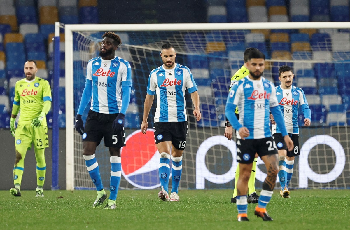 Soccer Football - Serie A - Napoli v Spezia - Stadio Diego Armando Maradona, Naples, Italy - January 6, 2021 Napoli's Nikola Maksimovic and teammates look dejected after Spezia's M'Bala Nzola scored their first goal REUTERS