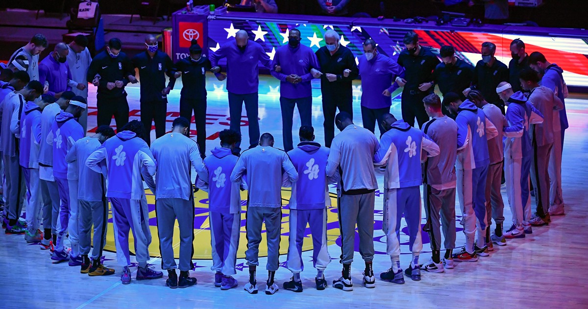Jan 7, 2021; Los Angeles, California, USA;  The Los Angeles Lakers and San Antonio Spurs join hands at center court during the national anthem at Staples Center. Mandatory Credit: Robert Hanashiro-USA TODAY Sports
