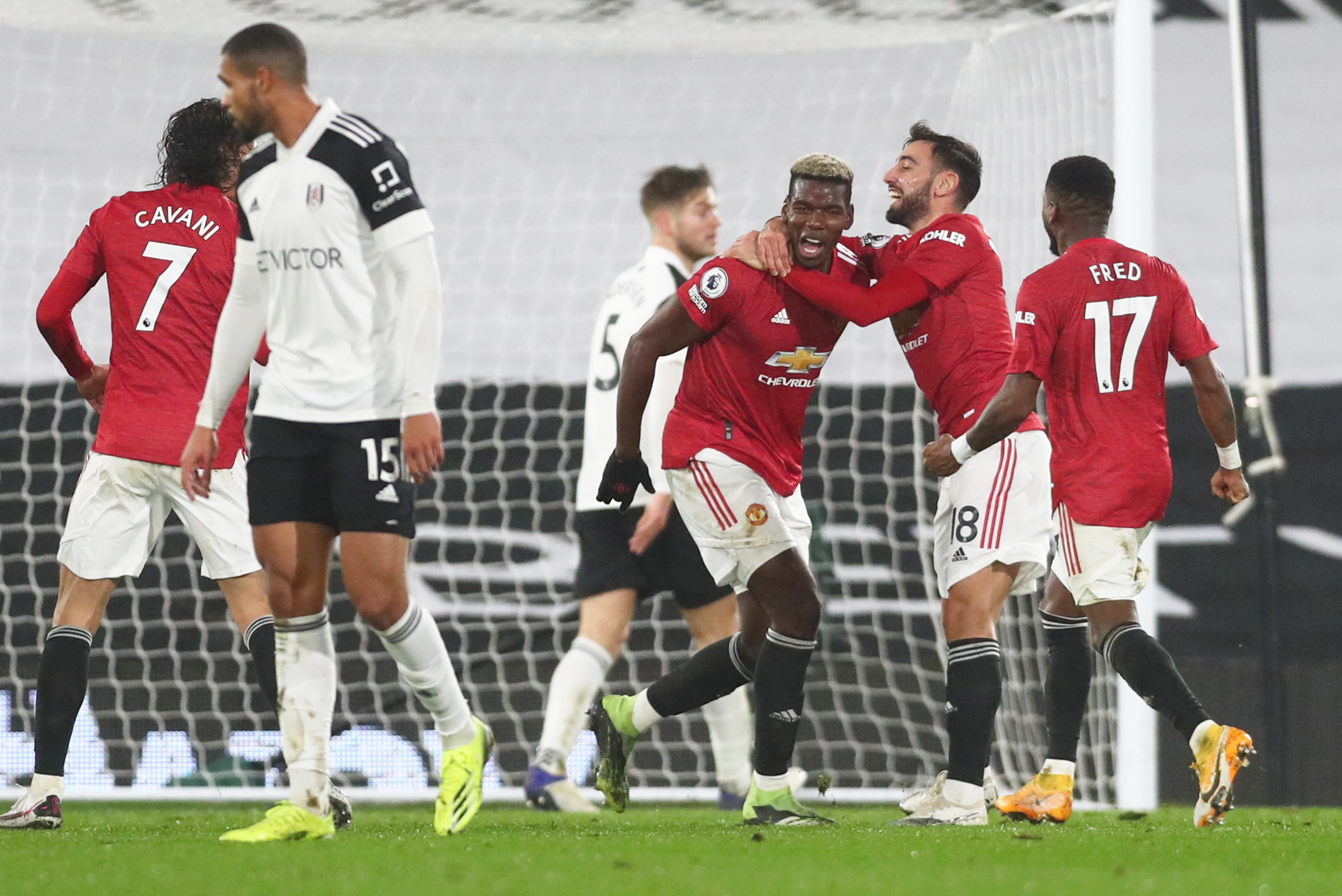 Soccer Football - Premier League - Fulham v Manchester United - Craven Cottage, London, Britain - January 20, 2021 Manchester United's Paul Pogba celebrates scoring their second goal with Bruno Fernandes Pool via REUTERS