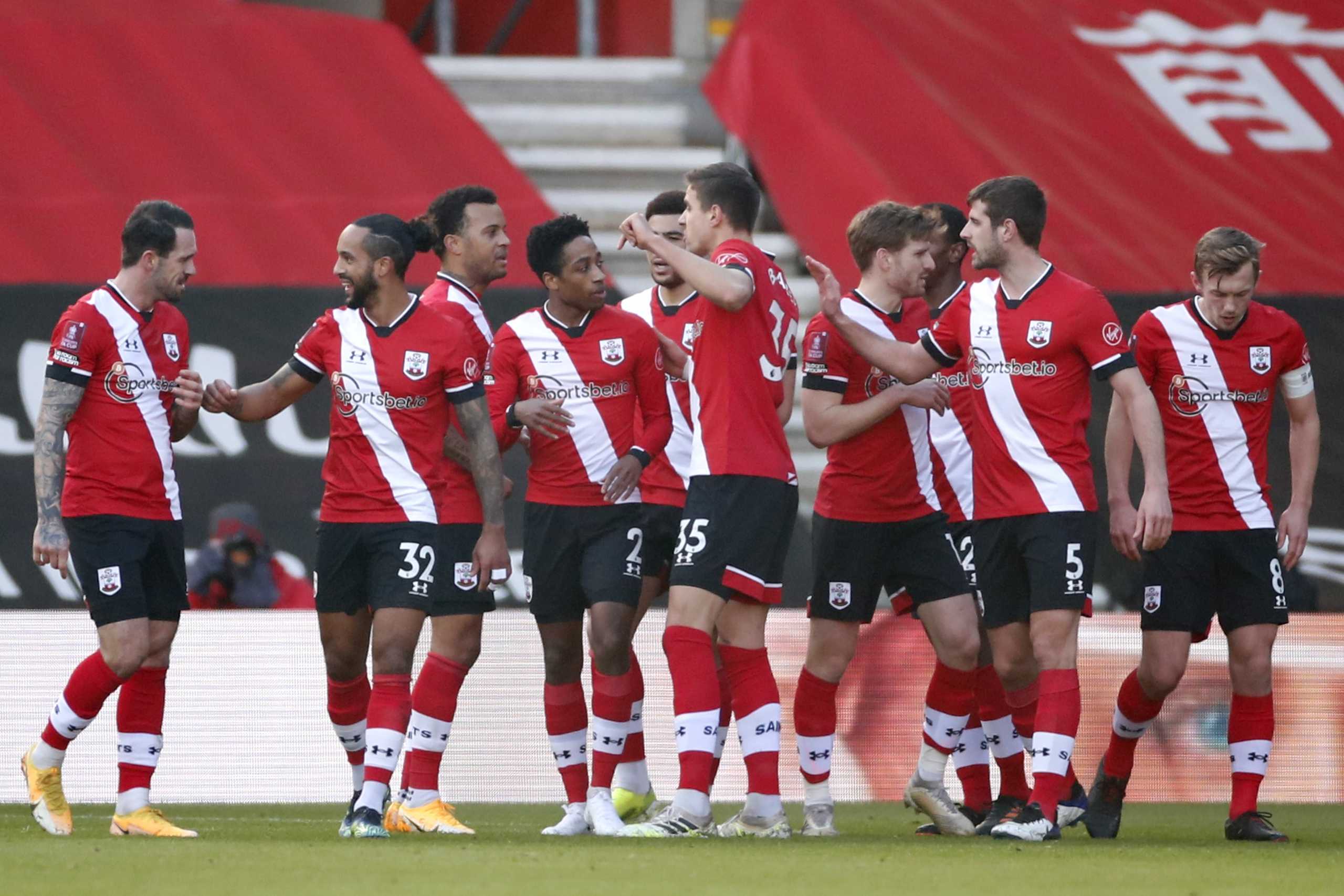 Soccer Football - FA Cup - Fourth Round - Southampton v Arsenal - St Mary's Stadium, Southampton, Britain - January 23, 2021 Southampton's Kyle Walker-Peters celebrates scoring their first goal with teammates Action Images via Reuters