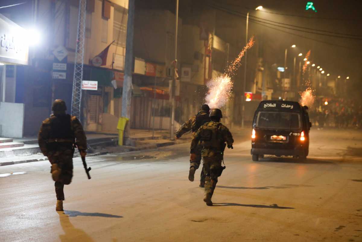 Security forces clash with demonstrators during anti-government protests in Tunis, Tunisia, January 18, 2021. REUTERS