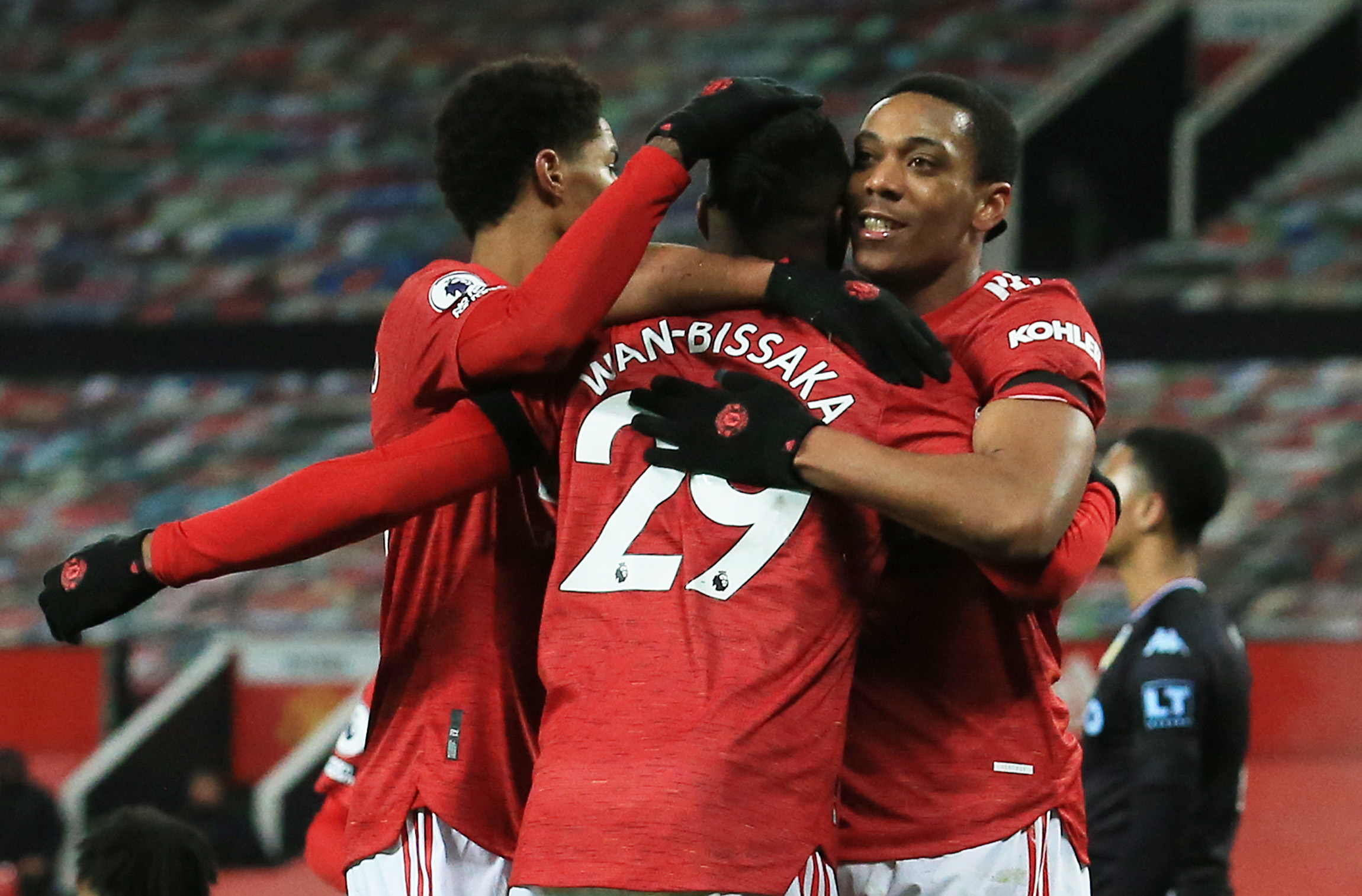 Soccer Football - Premier League - Manchester United v Aston Villa - Old Trafford, Manchester, Britain - January 1, 2021 Manchester United's Anthony Martial celebrates scoring their first goal with teammates Pool via REUTERS