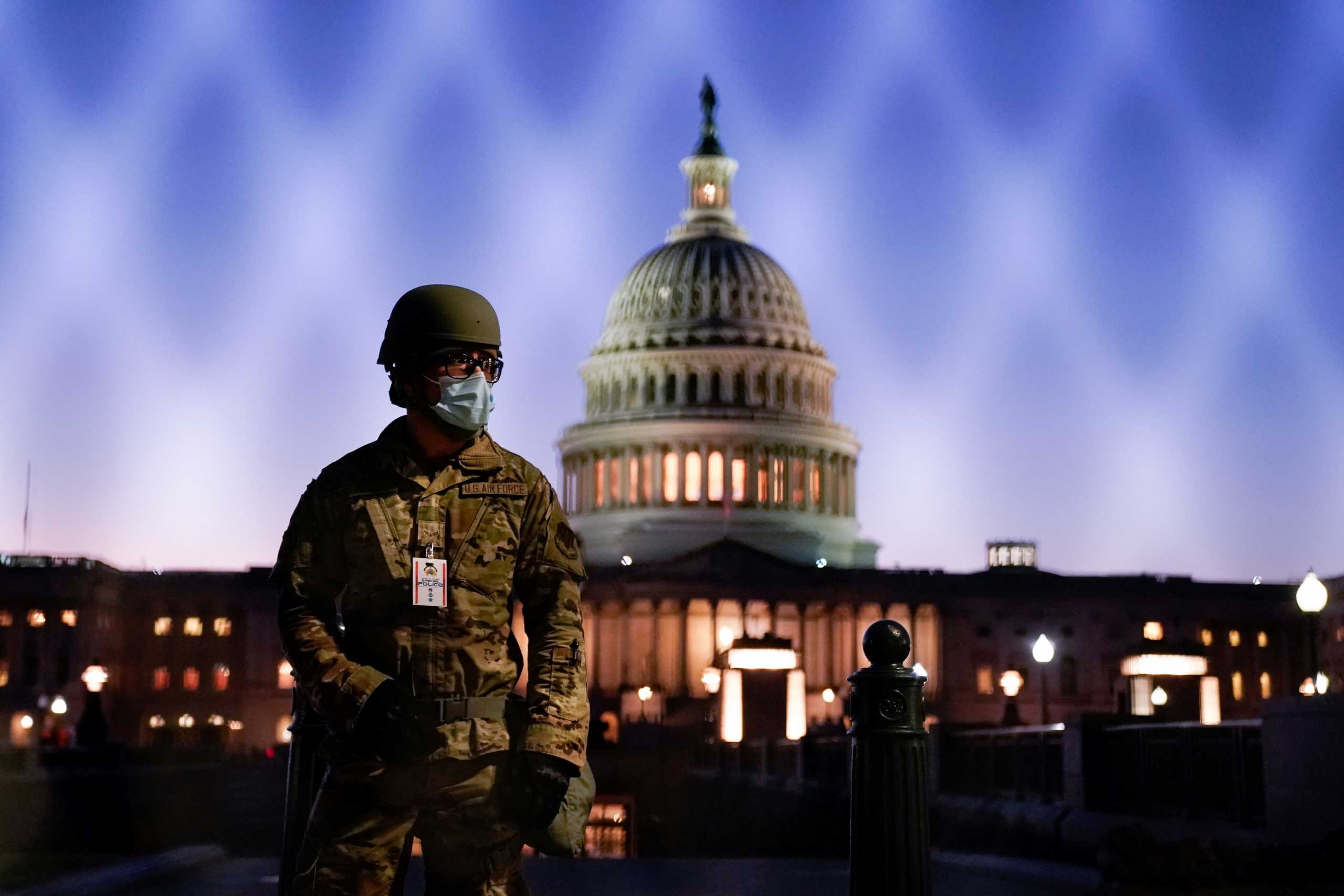 FILE PHOTO: Members of the National Guard gather at the U.S. Capitol as the House of Representatives prepares to begin the voting process on a resolution demanding U.S. Vice President Pence and the cabinet remove President Trump from office, in Washington, U.S., January 12, 2021. REUTERS