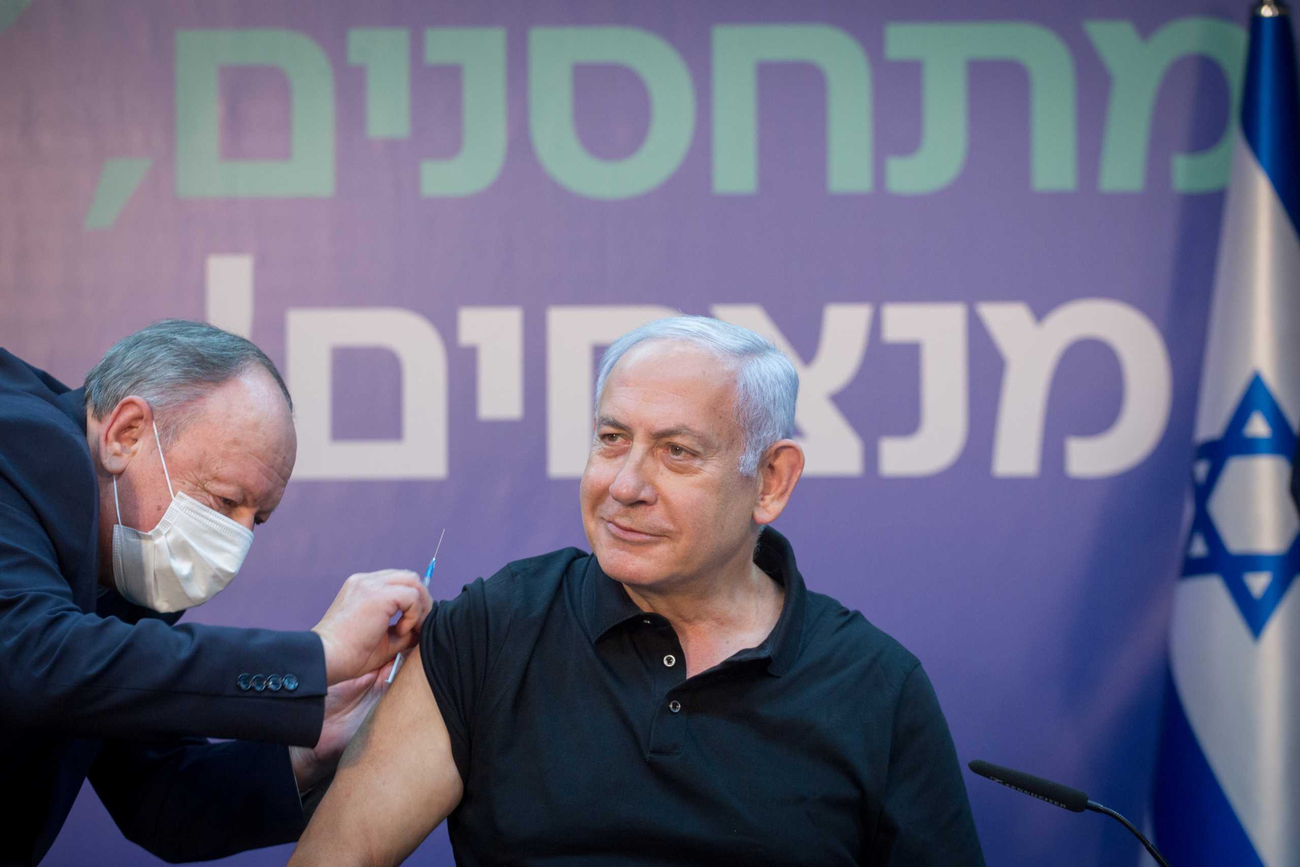 Israeli Prime Minister Minister Benjamin Netanyahu receives the second dose of the coronavirus disease (COVID-19) vaccine at Sheba Medical Center in Ramat Gan, Israel, January 9, 2021.   Miriam Elster