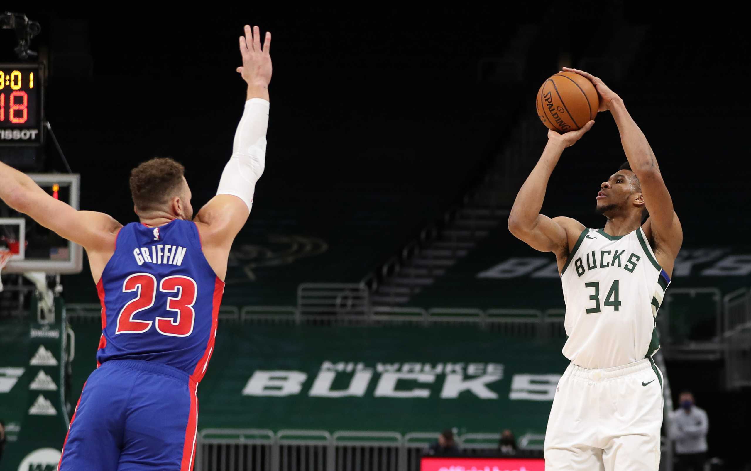 Jan 6, 2021; Milwaukee, WI, USA;  Milwaukee Bucks forward Giannis Antetokounmpo (34) shoots against Detroit Pistons forward Blake Griffin (23) at the Bradley Center.  Mandatory Credit: Nick Monroe