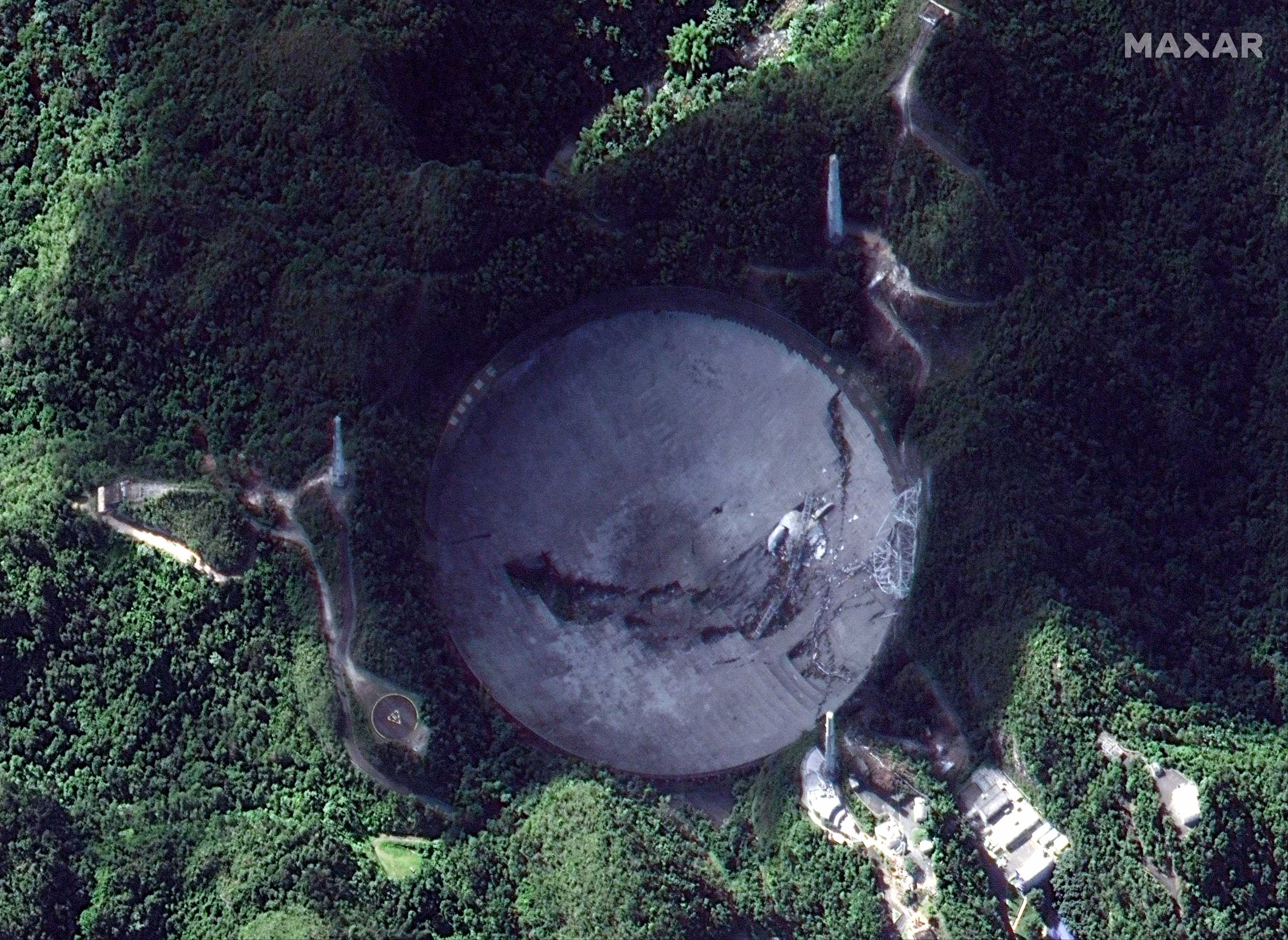 A satellite image shows an overview of the Arecibo Observatory after it collapsed in Puerto Rico December 6, 2020. Satellite image ©2020 Maxar Technologies
