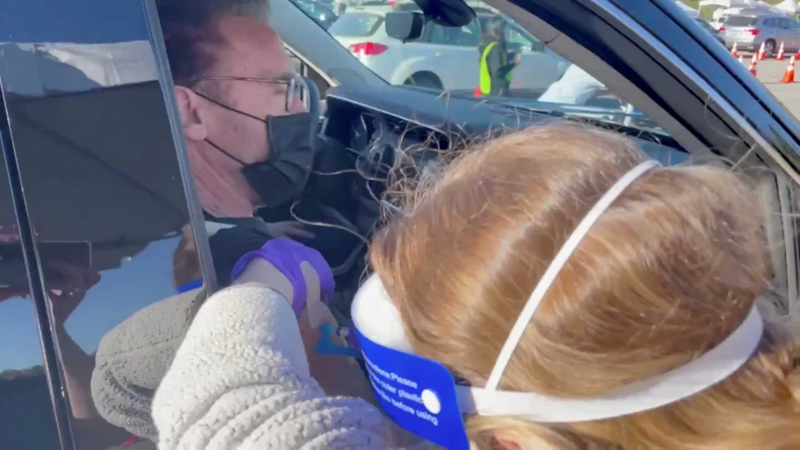Former California governor Arnold Schwarzenegger receives a coronavirus disease (COVID-19) vaccine at a drive by vaccine center at the Dodger Stadium in Los Angeles, U.S. January 20, 2021 in this still image obtained by Reuters from a video on January 21, 2021. ARNOLD SCHWARZENEGGER