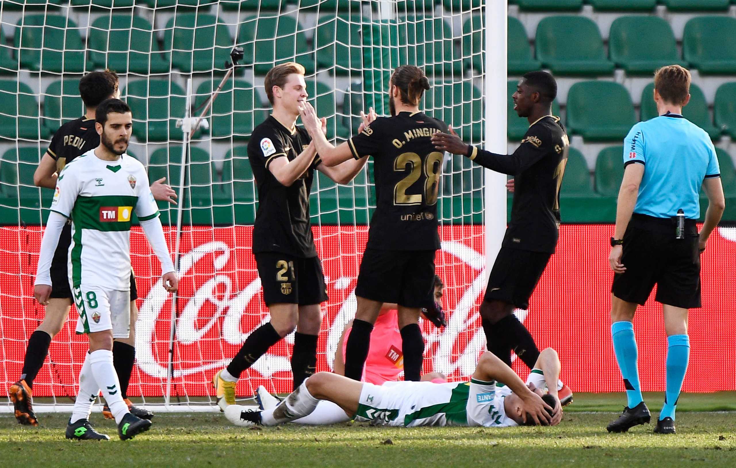 Soccer Football - La Liga Santander - Elche v FC Barcelona -  Estadio Manuel Martinez Valero, Elche, Spain - January 24, 2021 Barcelona's Frenkie de Jong celebrates scoring their first goal with teammates REUTERS