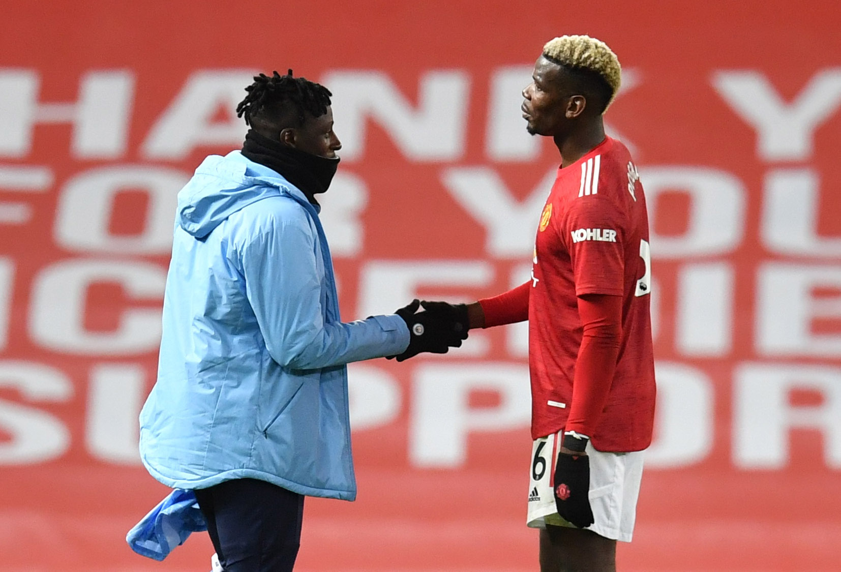 Soccer Football - Premier League - Manchester United v Manchester City - Old Trafford, Manchester, Britain - December 12, 2020 Manchester United's Paul Pogba shakes hands with Manchester City's Benjamin Mendy after the match Pool via REUTERS