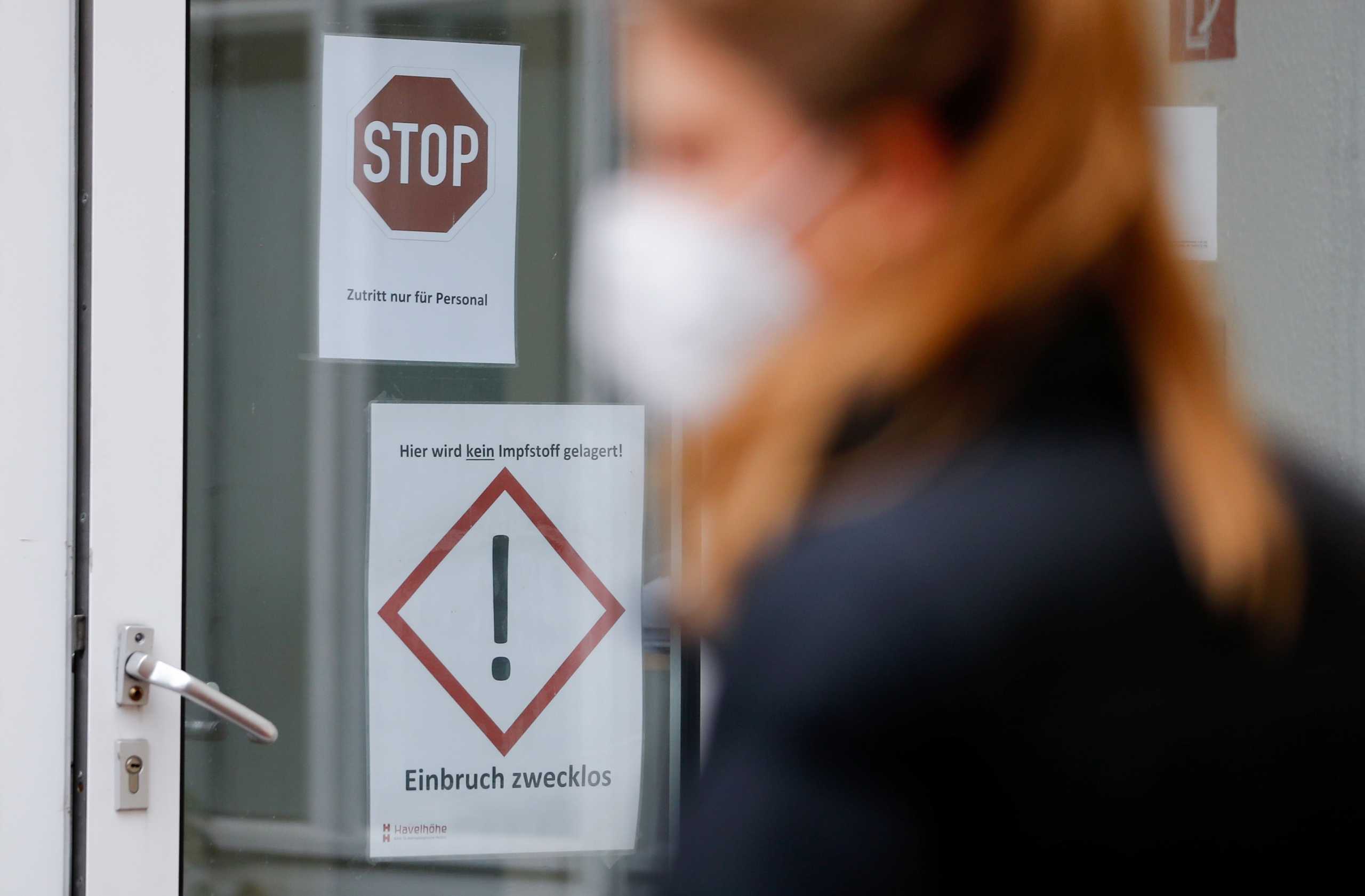 A sign reads "No vaccine is stored here! Break-in pointless" as the Pfizer-BioNTech coronavirus disease (COVID-19) vaccine is administered at Havelhoehe community hospital in Berlin, Germany, January 14, 2021. REUTERS