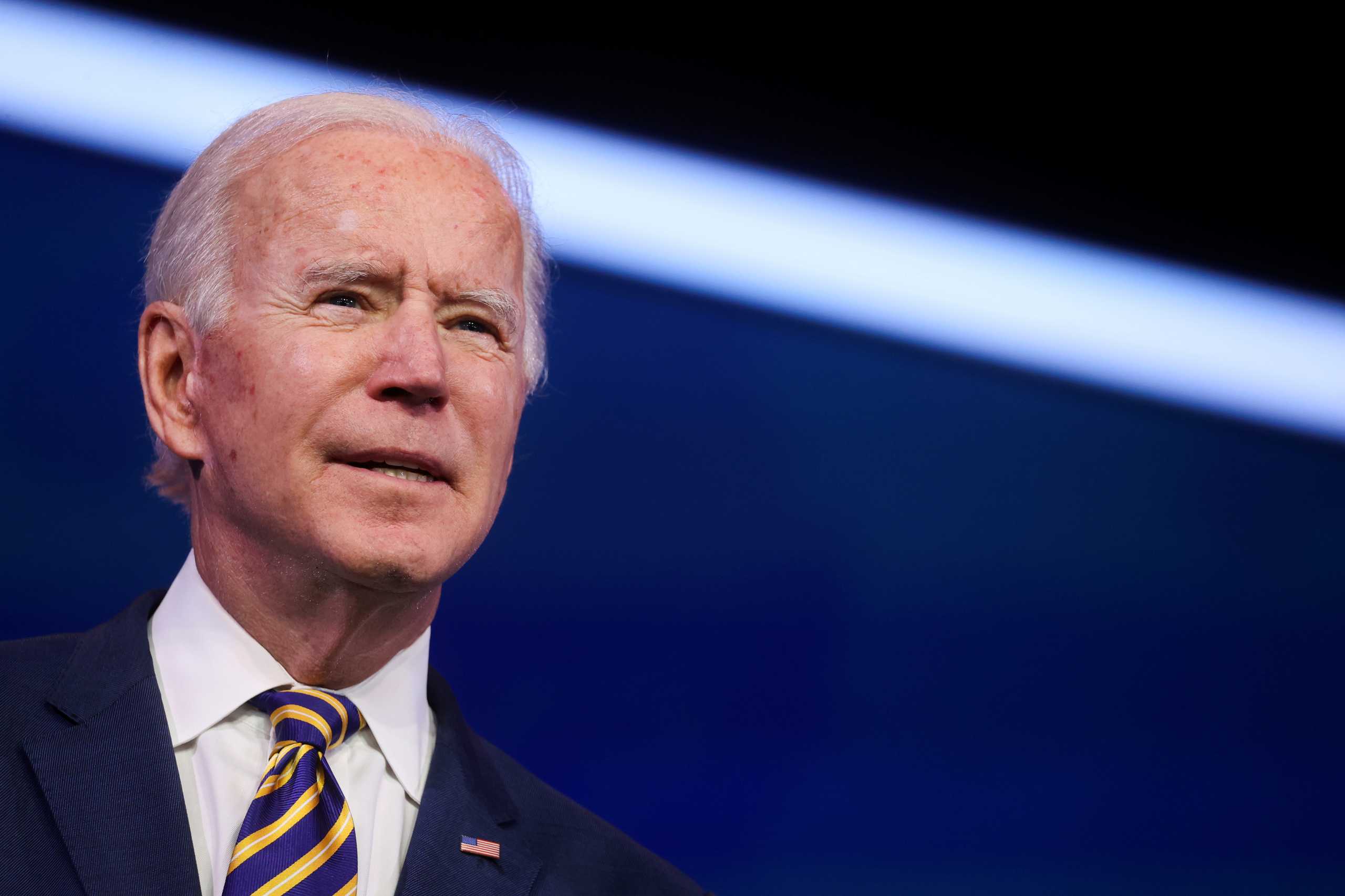 FILE PHOTO: U.S. President-elect Joe Biden delivers remarks on the U.S. response to the coronavirus disease (COVID-19) outbreak, at his transition headquarters in Wilmington, Delaware, U.S., December 29, 2020. REUTERS