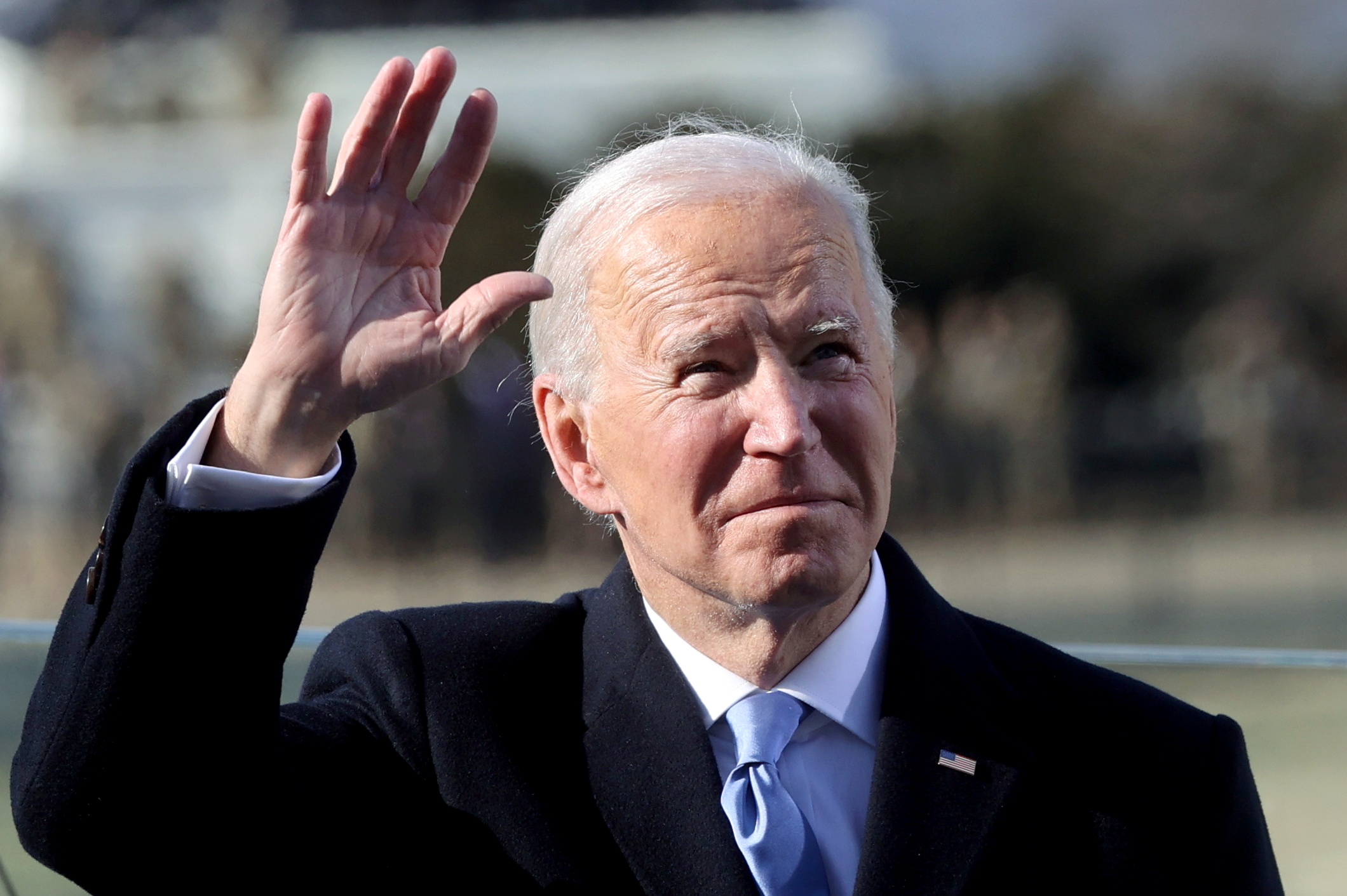 President Joe Biden waves after being sworn in as the 46th President of the United States, during his inauguration on the West Front of the U.S. Capitol in Washington, U.S., January 20, 2021. REUTERS