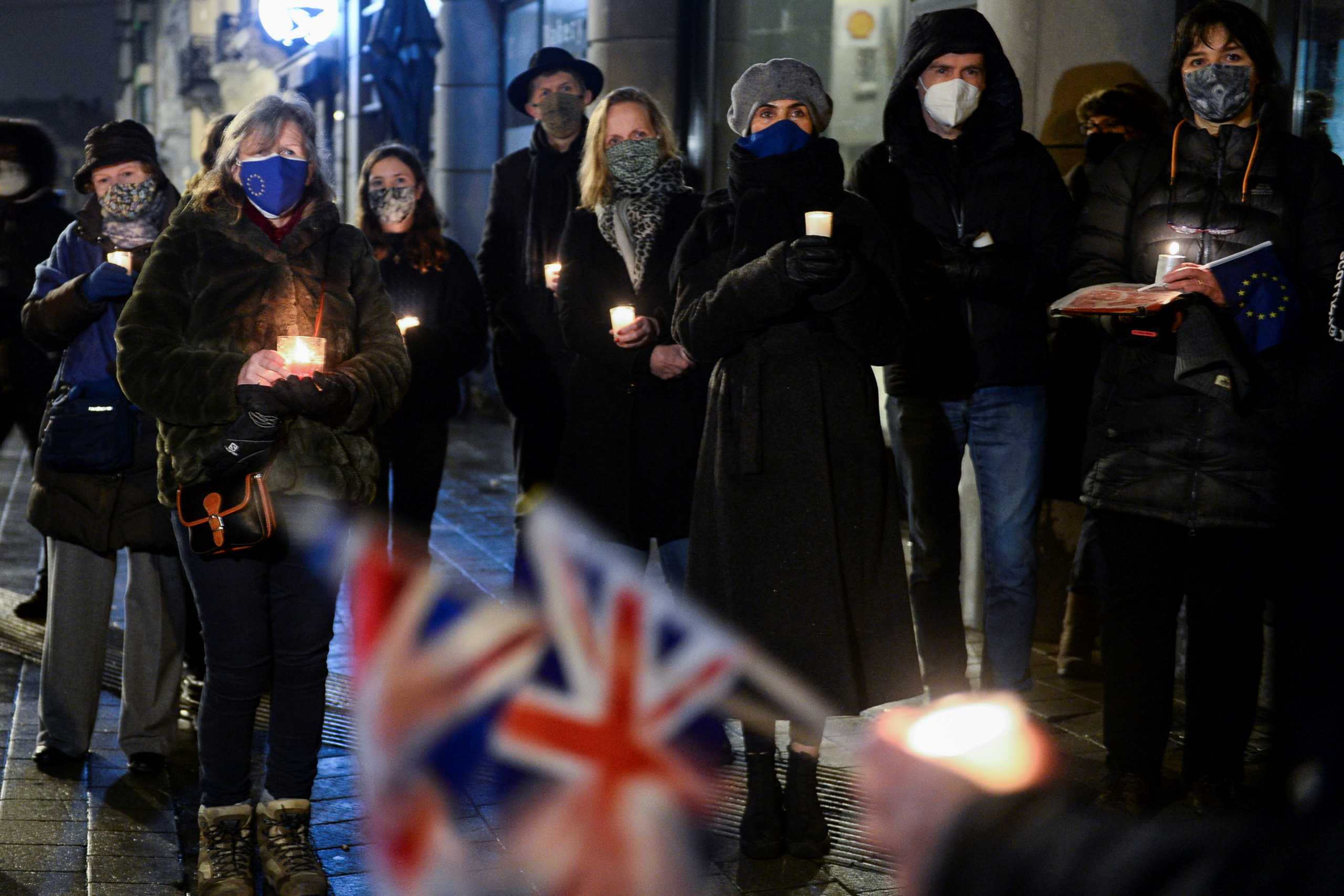 British people living in Brussels who oppose Brexit hold a candlelit vigil outside the British embassy as the transition period comes to an end in Brussels, Belgium December 31, 2020. REUTERS