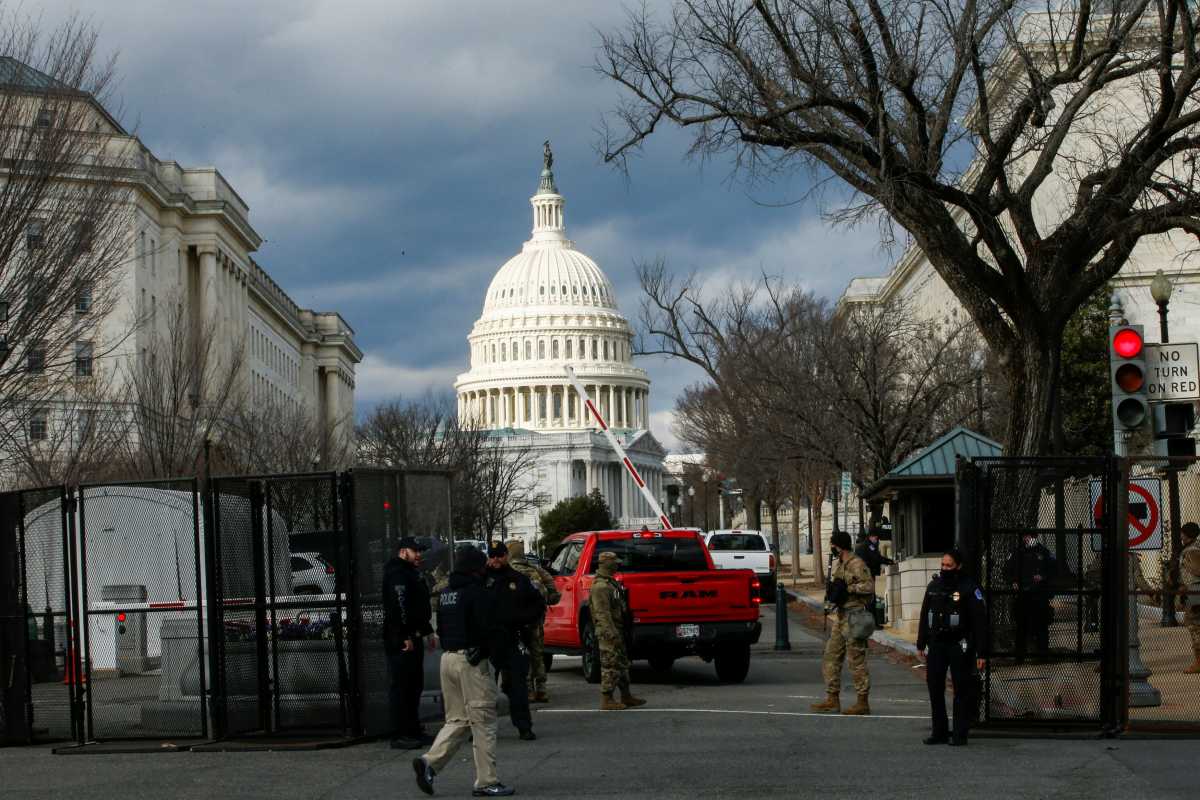 National Guard members and Police officers secure one of the street entrance to Capitol ahead of U.S. President-elect Joe Biden's inauguration, in Washington, U.S., January 17, 2021. REUTERS
