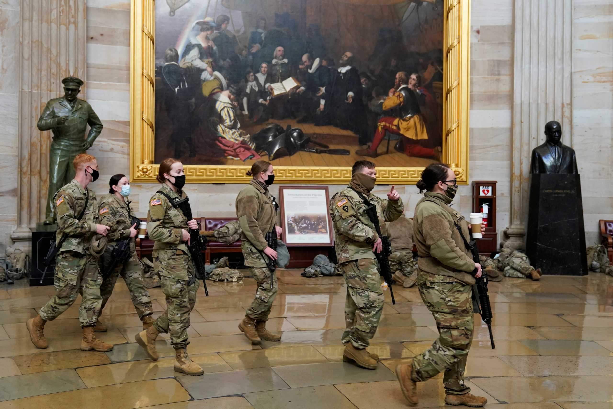 National Guard members walk through the U.S. Capitol, before Democrats begin debating one article of impeachment against U.S. President Donald Trump, in Washington, U.S., January 13, 2021. REUTERS