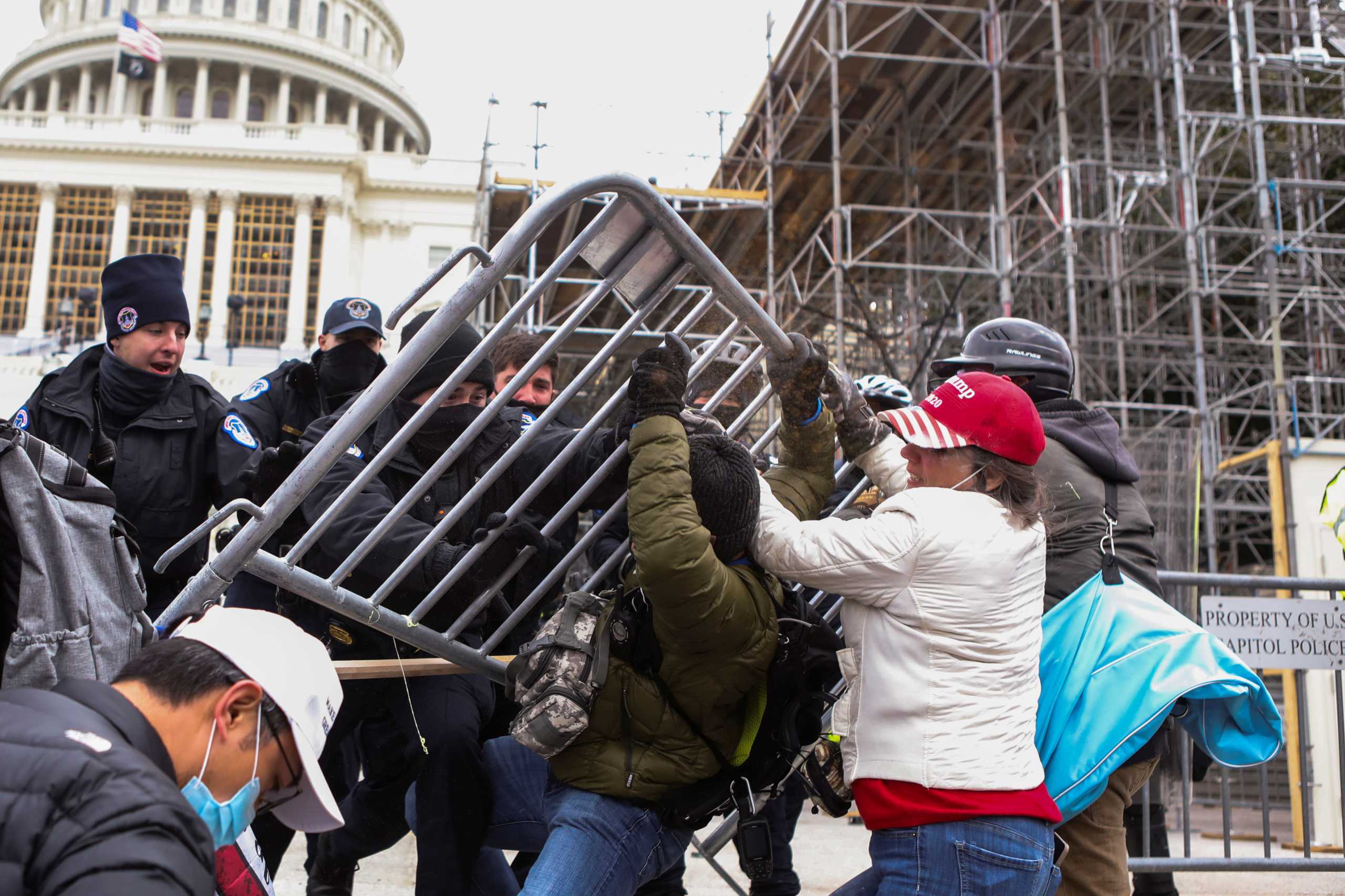 Law enforcement officers push back against supporters of U.S. President Donald Trump attempting to enter U.S. Capitol during a protest against the certification of the 2020 U.S. presidential election results by the U.S. Congress, in Washington, U.S., January 6, 2021. REUTERS