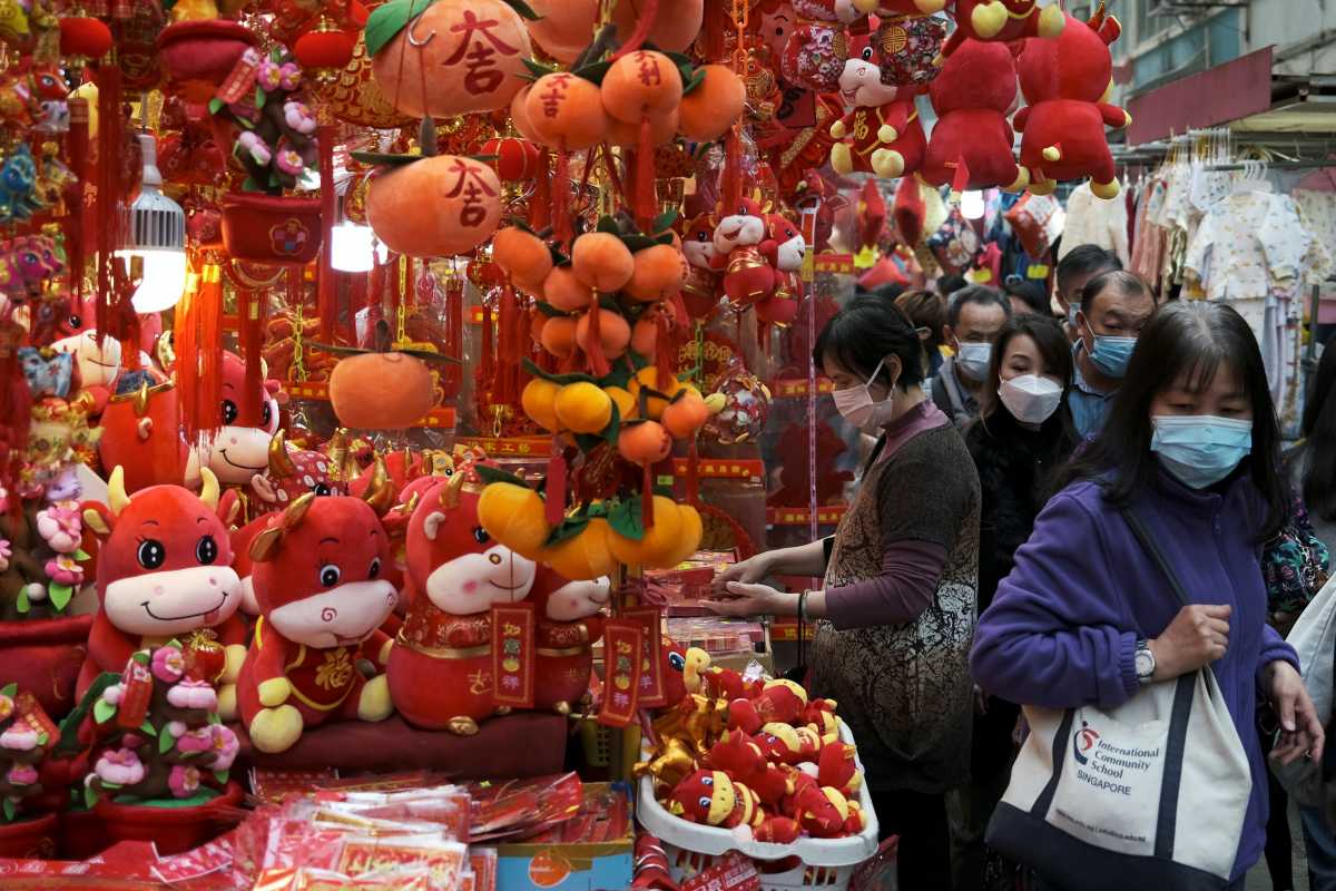 Customers wearing face mask shop for decorations, ahead of the Chinese Lunar New Year, following the coronavirus disease (COVID-19) outbreak, in Hong Kong, China January 28, 2021. REUTERS