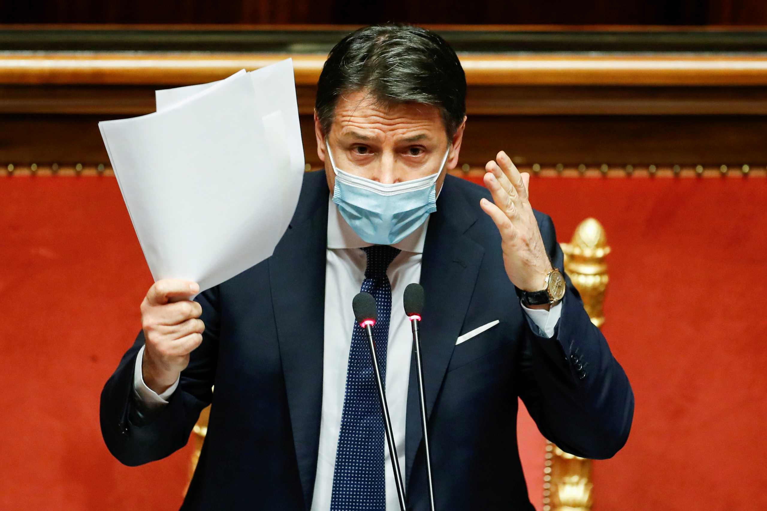 FILE PHOTO: Italian Prime Minister Giuseppe Conte gestures as he speaks ahead of a confidence vote at the upper house of parliament after former Prime Minister Matteo Renzi pulled his party out of government, in Rome, Italy, January 19, 2021. REUTERS