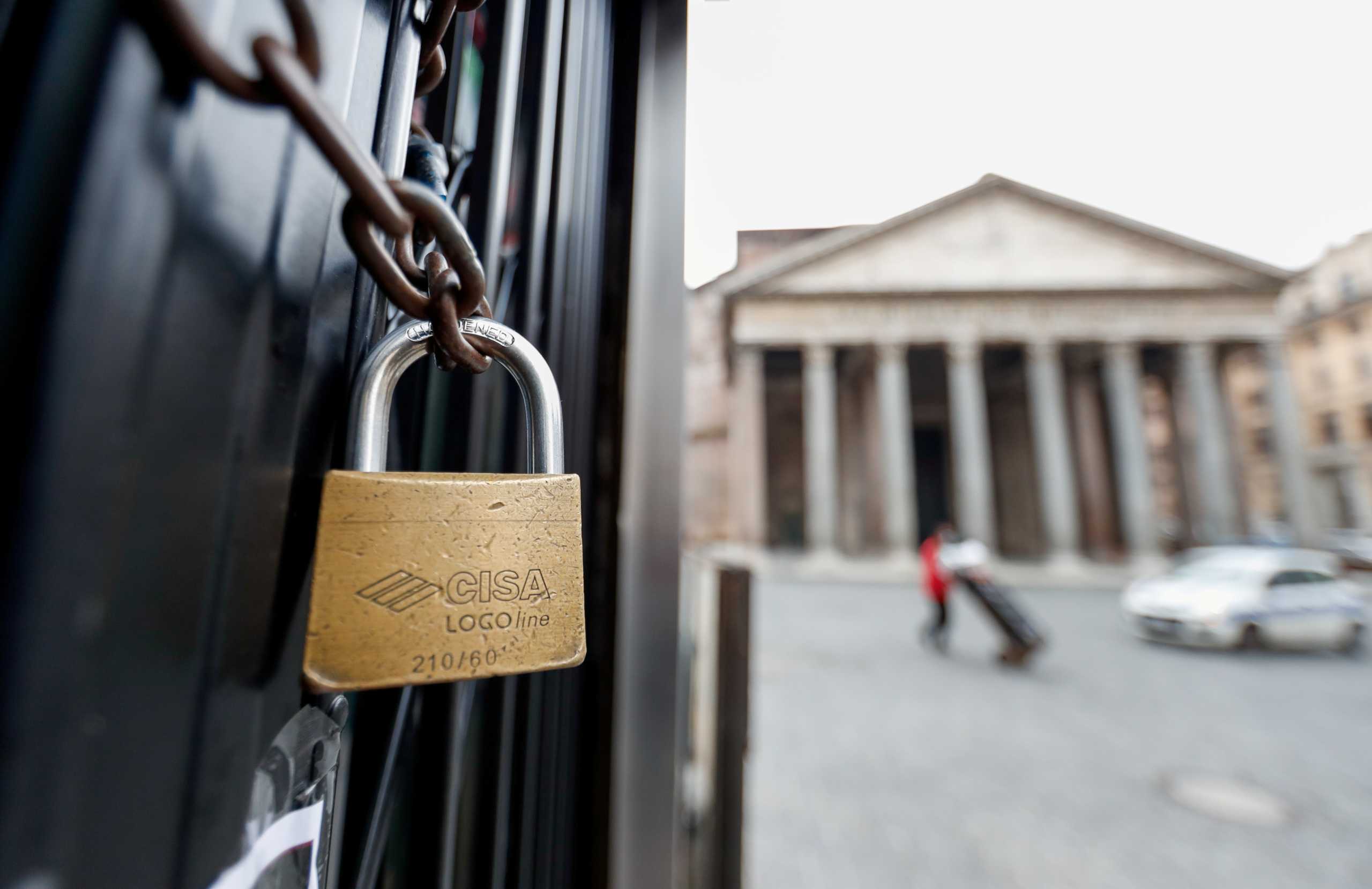 A padlock is seen on the door of a closed restaurant near the Pantheon, as the region enters the 'yellow zone' after the government relaxed some of the coronavirus disease (COVID-19) curbs on weekdays following a strict lockdown over the holidays, in Rome, Italy January 7, 2021. REUTERS