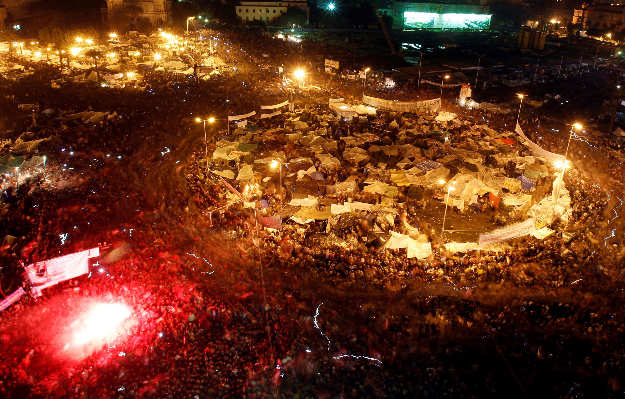 FILE PHOTO: Thousands of Egyptian anti-government protesters celebrate inside Tahrir Square after the announcement of Egyptian President Hosni Mubarak's resignation in Cairo, Egypt, February 11, 2011. REUTERS