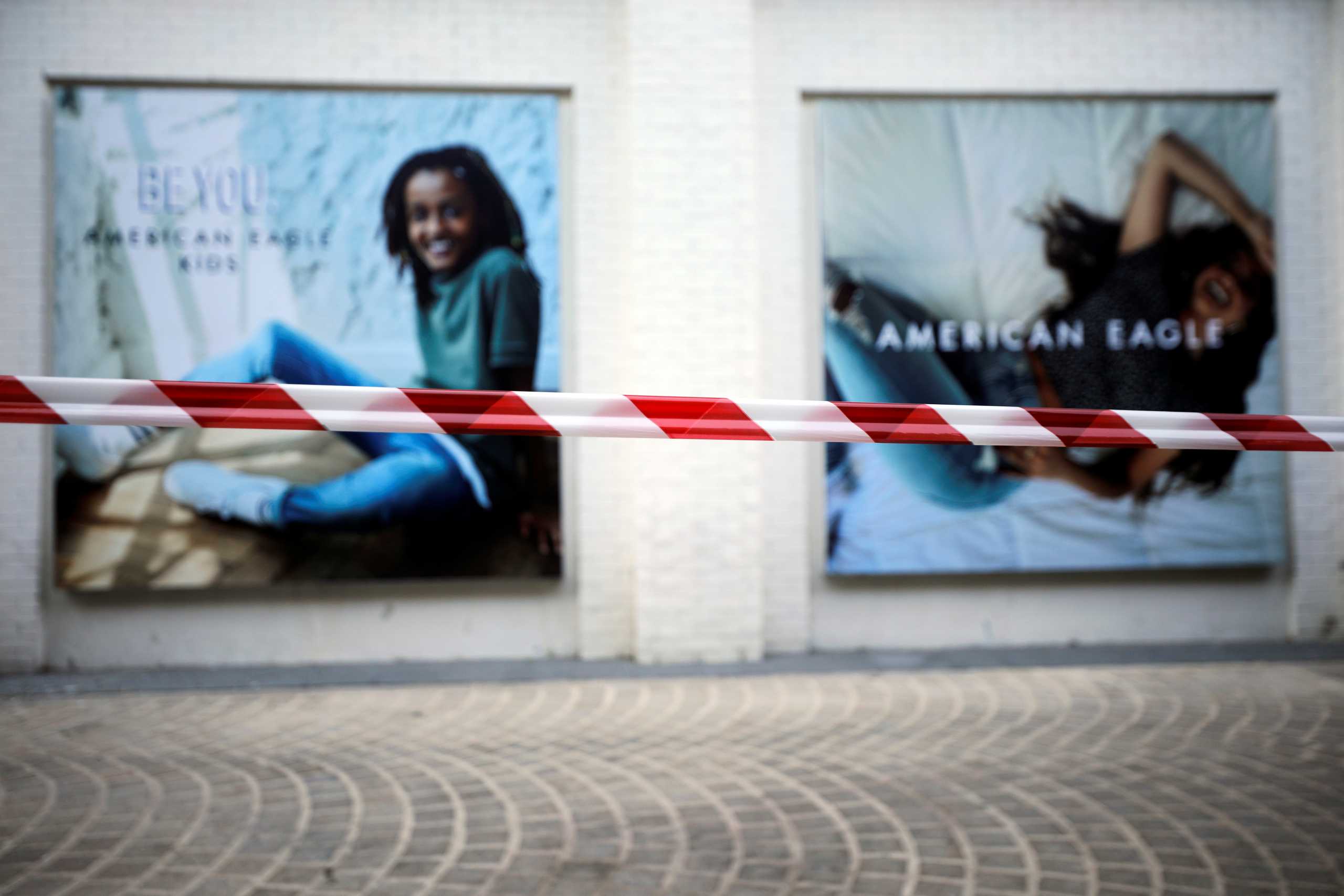 Police barrier tape is seen in a fashion shopping center as Israel tightens a national lockdown in a bid to curb a sharp rise in new coronavirus disease (COVID-19) infections in Ashdod, Israel January 8, 2021. REUTERS