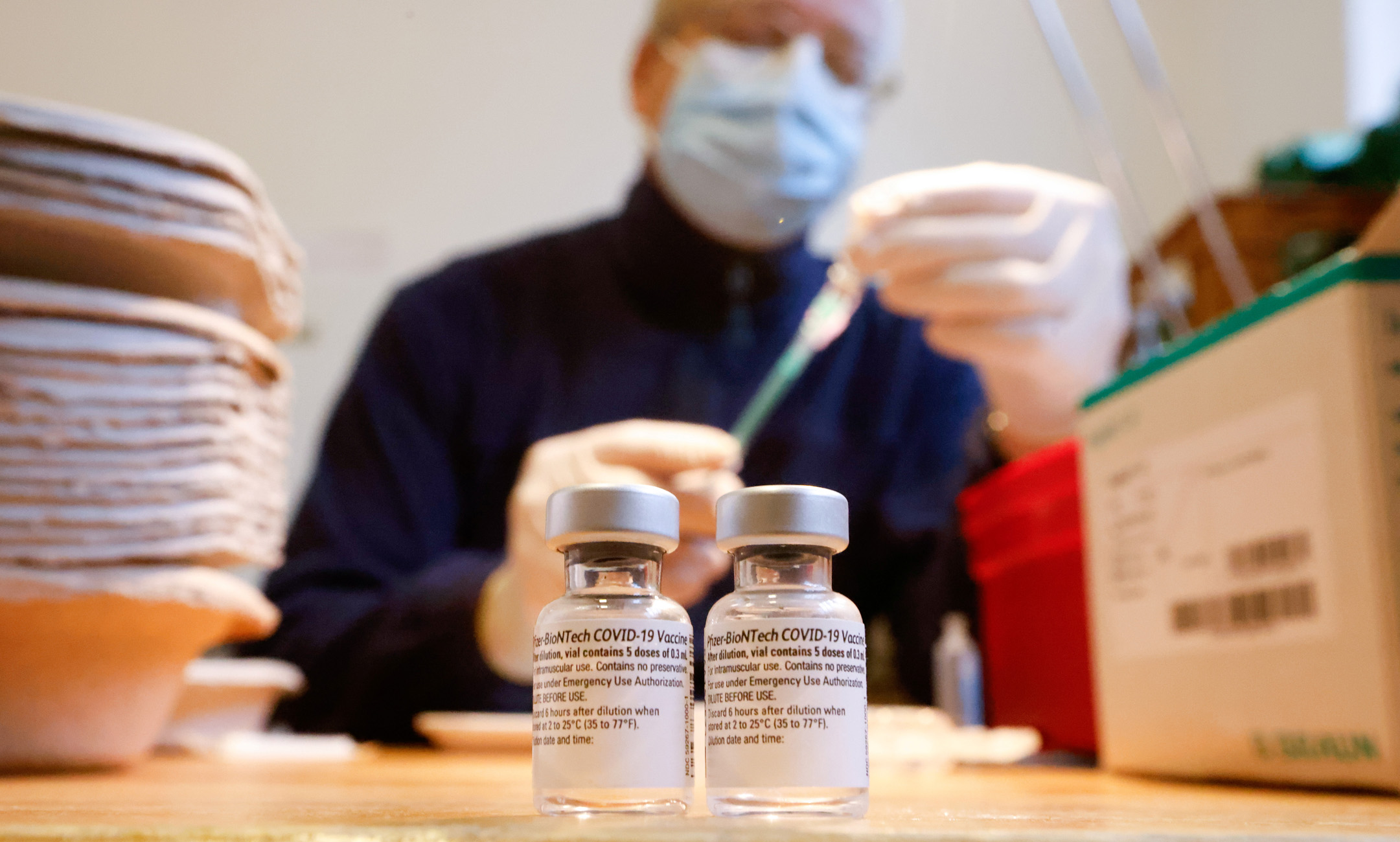 Vials contain the Pfizer-BioNTech coronavirus disease (COVID-19) vaccine at Havelhoehe community hospital in Berlin, Germany, January 14, 2021. REUTERS