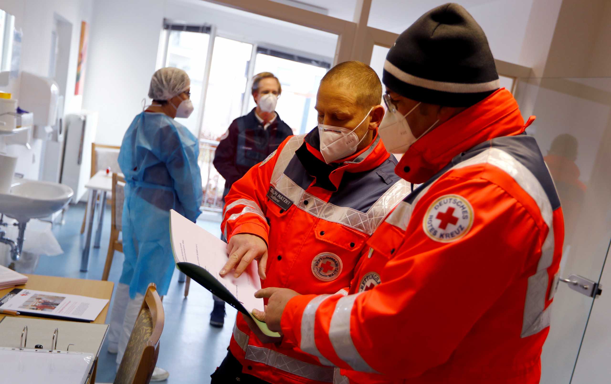 The medical team prepares before vaccination of the first person at Germany's federal state of Brandeburg with a dose of the Pfizer-BioNTech COVID-19 vaccine at the care home DRK-Seniorenwohnpark Grossraeschen, as the coronavirus disease (COVID-19) outbreak continues in Grossraeschen, Germany, December 27, 2020. REUTERS