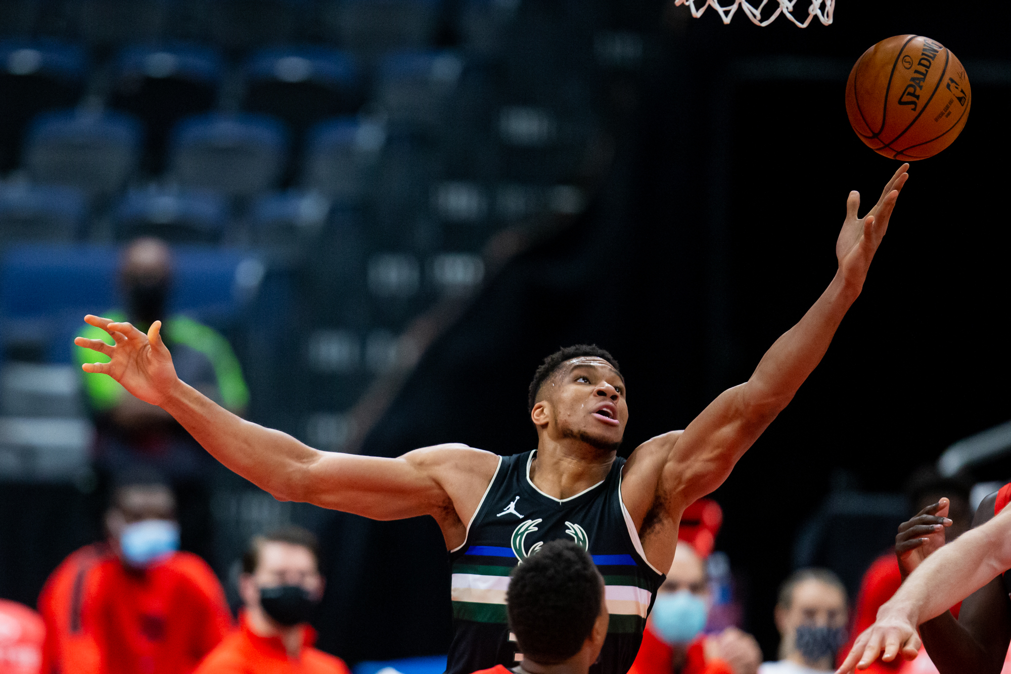 Jan 27, 2021; Tampa, Florida, USA; Milwaukee Bucks forward Giannis Antetokounmpo (34) reaches for a rebound during the first quarter of a game against the Toronto Raptors at Amalie Arena. Mandatory Credit: Mary Holt-USA TODAY Sports