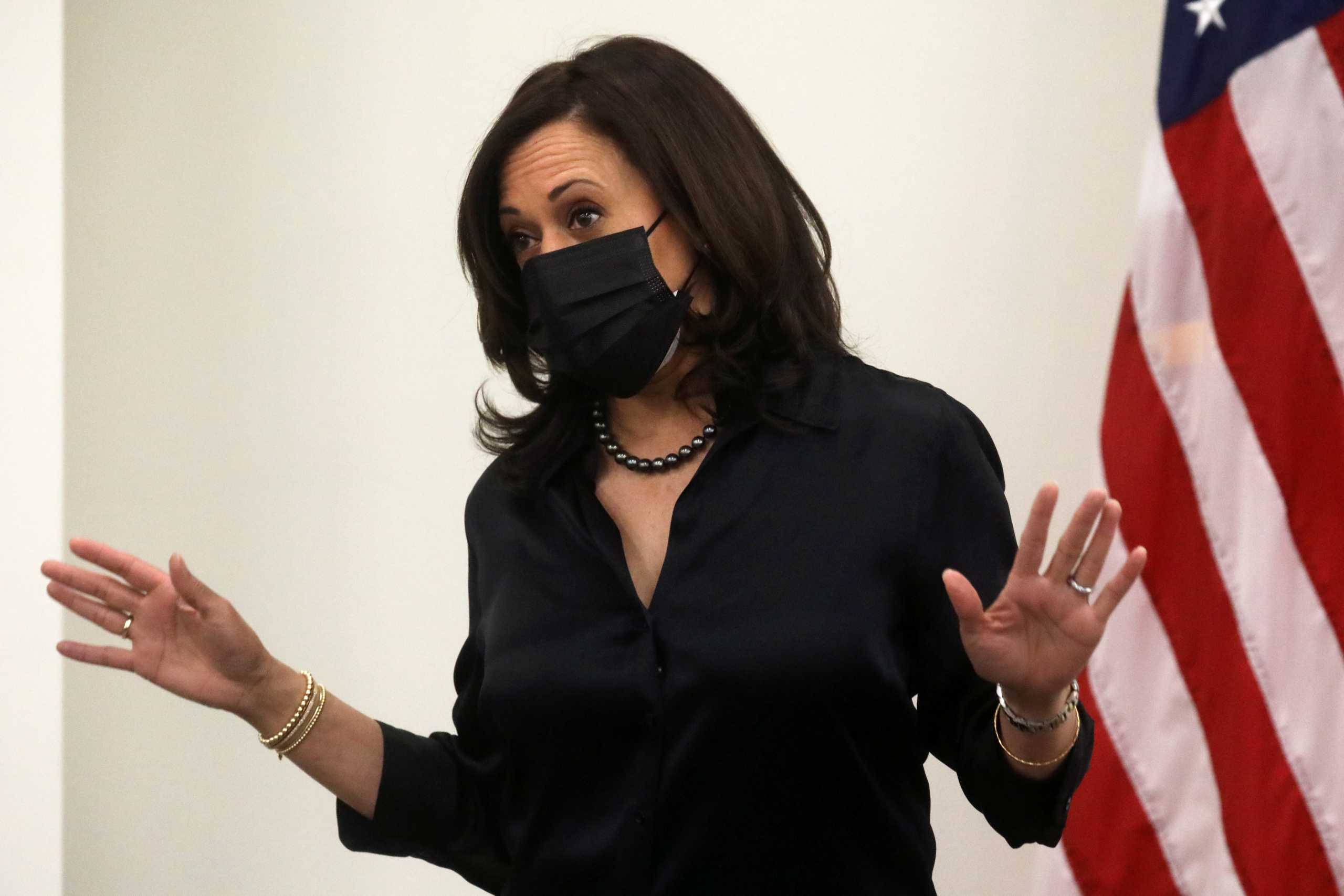 U.S. Vice President-elect Kamala Harris speaks to the media after receiving a dose of the Moderna COVID-19 vaccine at United Medical Center in Washington, U.S., December 29, 2020. REUTERS