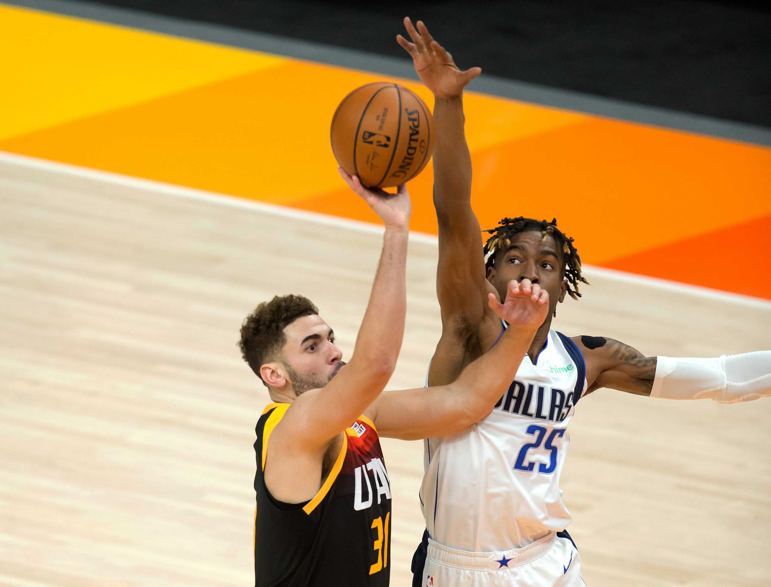 Jan 29, 2021; Salt Lake City, Utah, USA; Utah Jazz forward Georges Niang (31) shoots the ball against Dallas Mavericks forward Wes Iwundu (25) during the second half at Vivint Smart Home Arena. Mandatory Credit: Russell Isabella-USA TODAY Sports