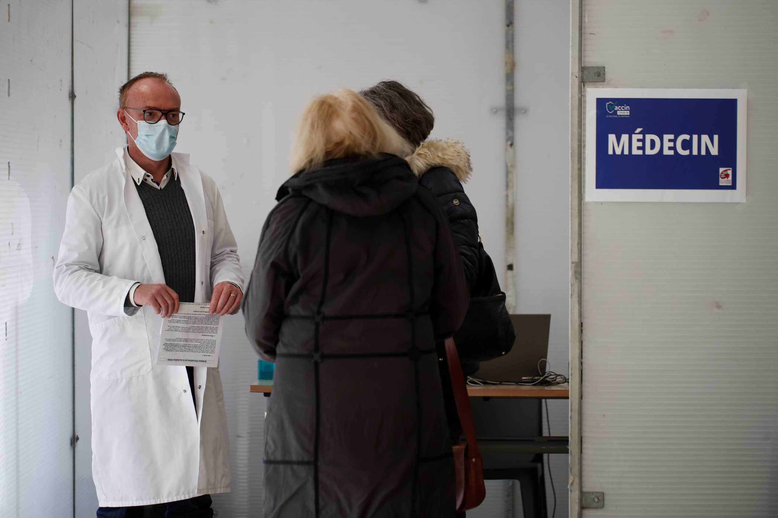 Elderly people, over 75 years of age, register to receive the Pfizer-BioNTech COVID-19 vaccine at a coronavirus disease vaccination center in Guingamp, France, January 22, 2021. REUTERS