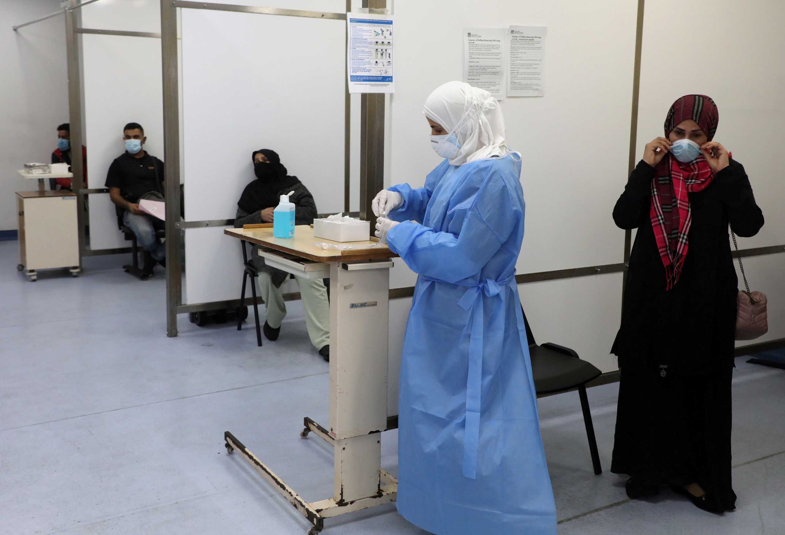 People wait to get tested for the coronavirus disease (COVID-19), at Rafik Hariri University Hospital, in Beirut, Lebanon January 4, 2021. Picture taken January 4, 2021. REUTERS