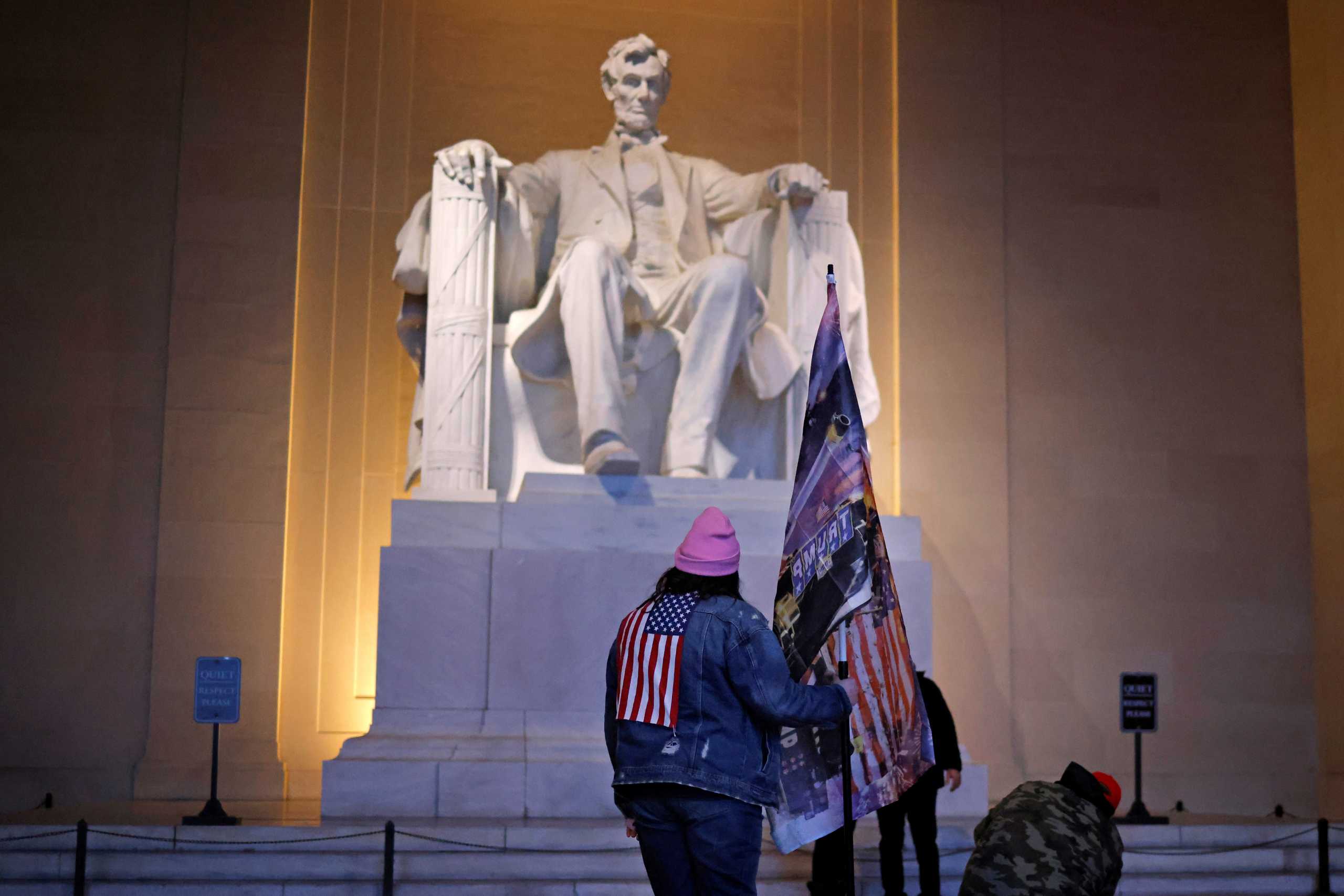 A supporter of U.S. President Donald Trump stands at the Lincoln Memorial, a day after Trump supporters stormed the U.S. Capitol, in Washington, U.S., January 7, 2021. REUTERS