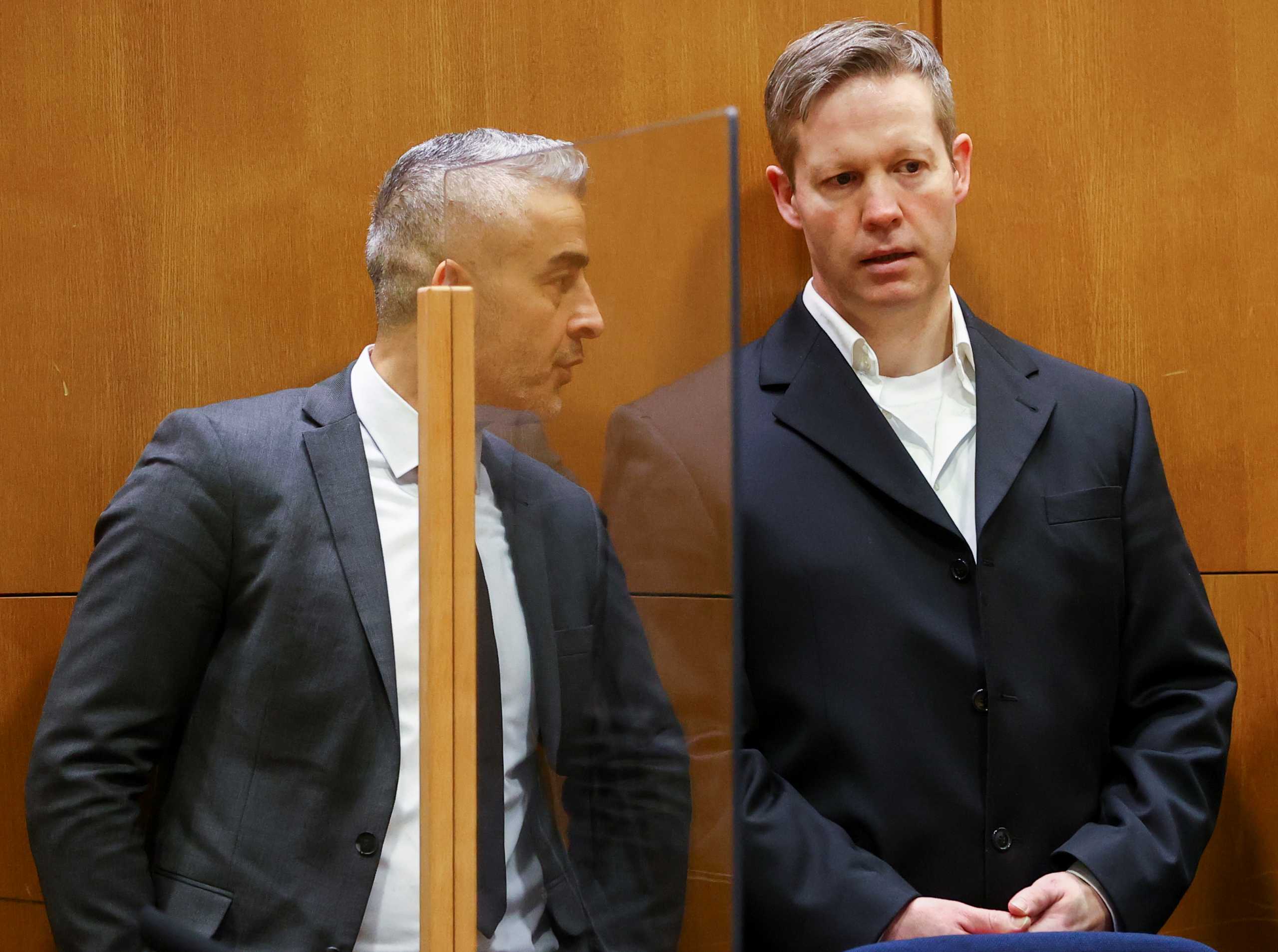 Main defendant Stephan Ernst speaks with his lawyer Mustafa Kaplan in the courtroom as they wait for the verdict in the case of the murder of Walter Luebcke, at the Higher Regional Court in Frankfurt, Germany January 28, 2021. REUTERS